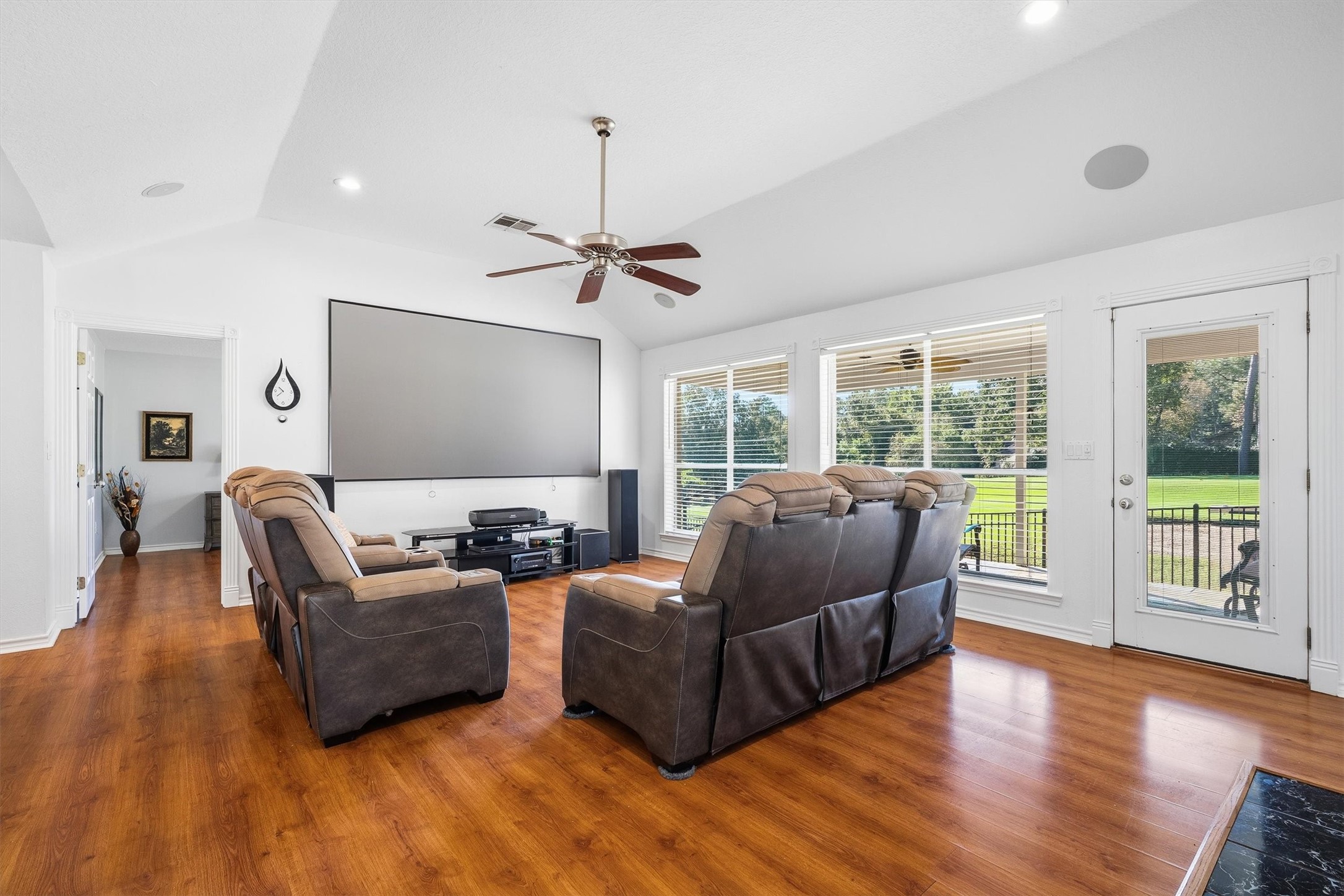 At the heart of the home, the oversized windows pull in natural light all day long and keep the fairway in sight without ever leaving the couch.