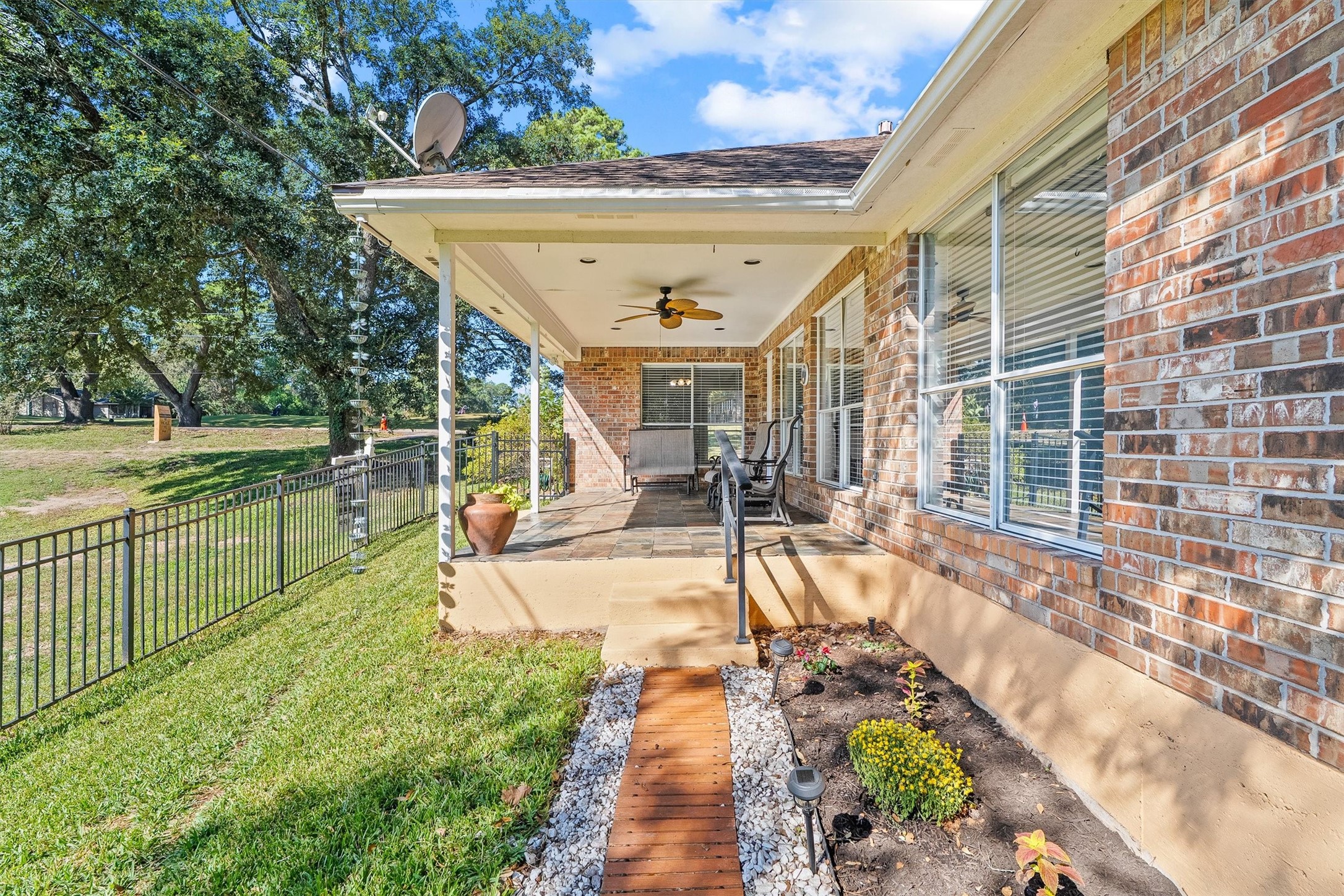A handrail at the patio edge and path lights along the garden bed make getting in and out of the backyard easy, day or night.