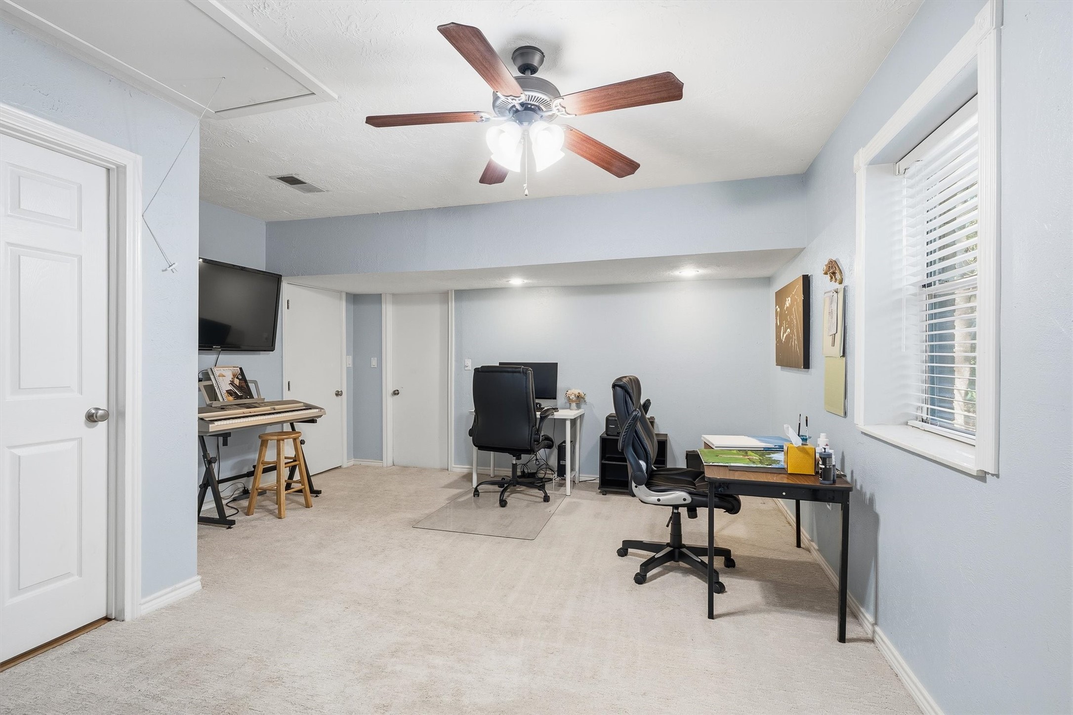 Once part of the original garage, this flex room now has space for a home office, a music corner, and whatever hobby comes next.