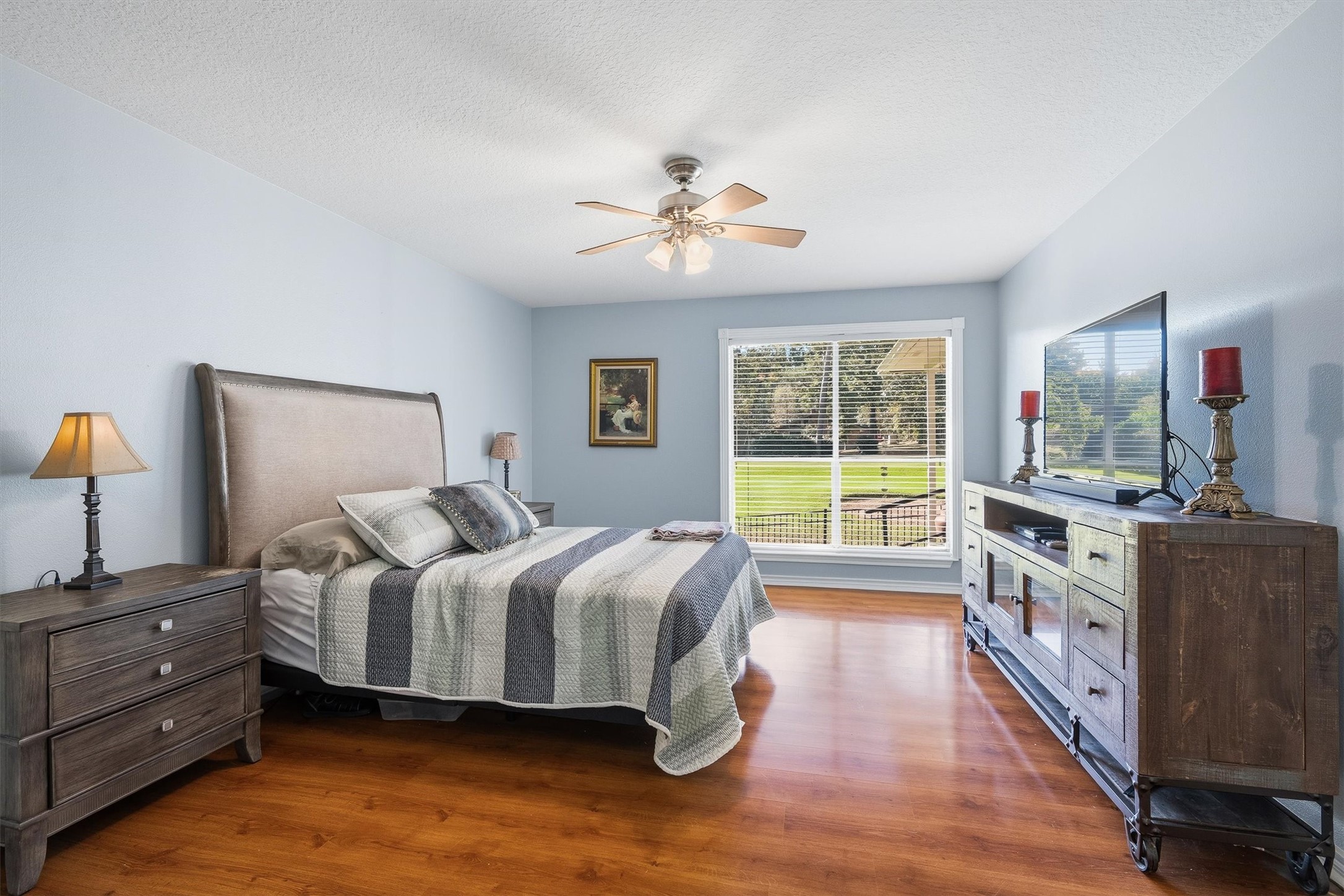 Tucked away on its own side of the home, the primary bedroom wakes up to a fairway view right outside the window.