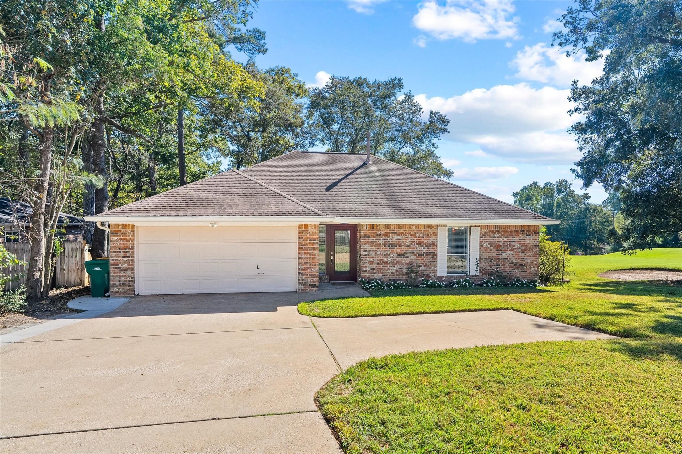The widened driveway makes room for cars, guests, and the occasional golf buddy, while the garage is sized as a golf cart garage, so your ride to the course stays tucked away. Lets head inside.