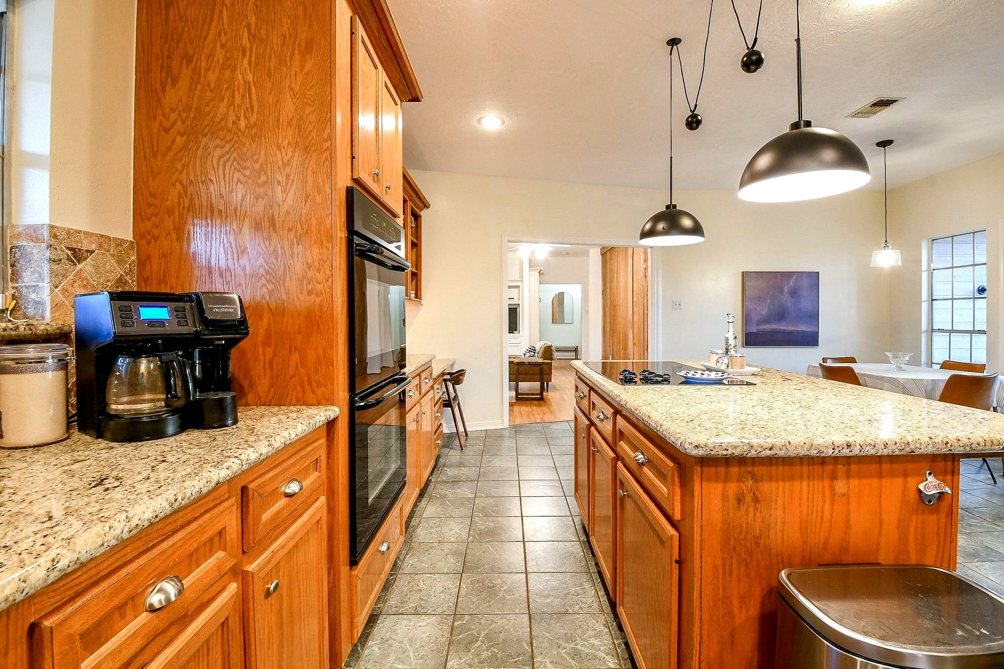 Primary residence kitchen with newly installed modern light fixture