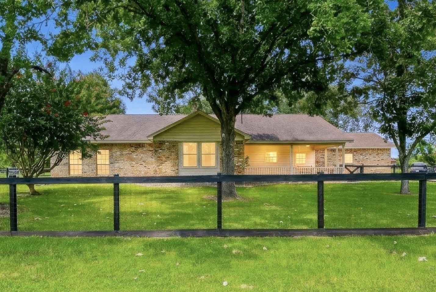 Front of primary house with fully fenced front yard