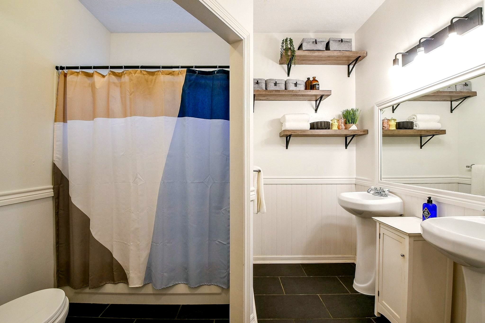 Jack and Jill bath connecting the second and third bedrooms in the primary house