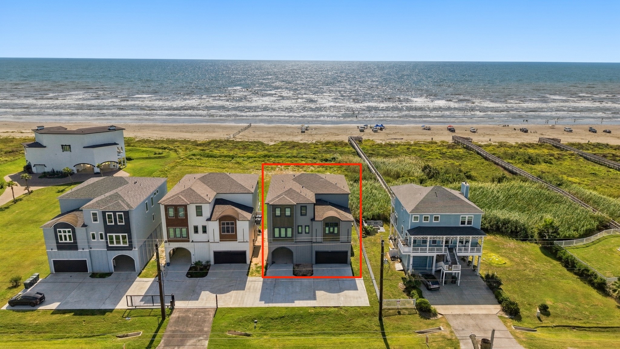 Aerial coastal setting
This aerial perspective highlights the homes position along Galvestons beachfront, with the dunes, sandy shoreline, and Gulf beyond. The highlighted home is shown within the surrounding coastal neighborhood; outlines are approximate.