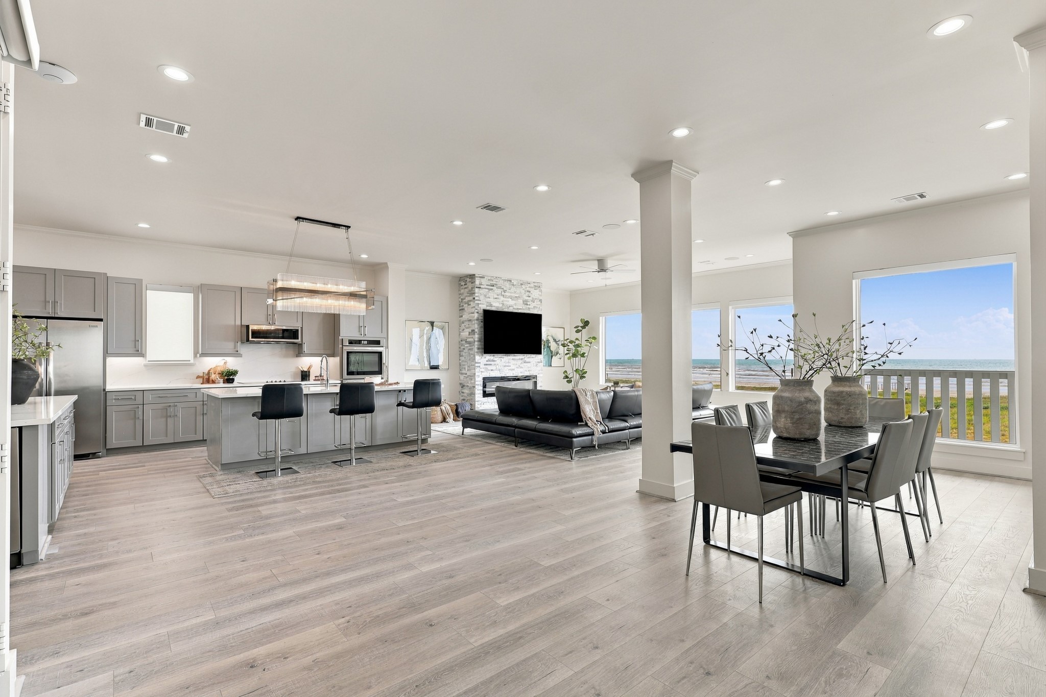 Enjoy Gulf views from the dining area, positioned beside the open kitchen and living room. The spacious layout provides a welcoming setting for dinners and weekend gatherings.