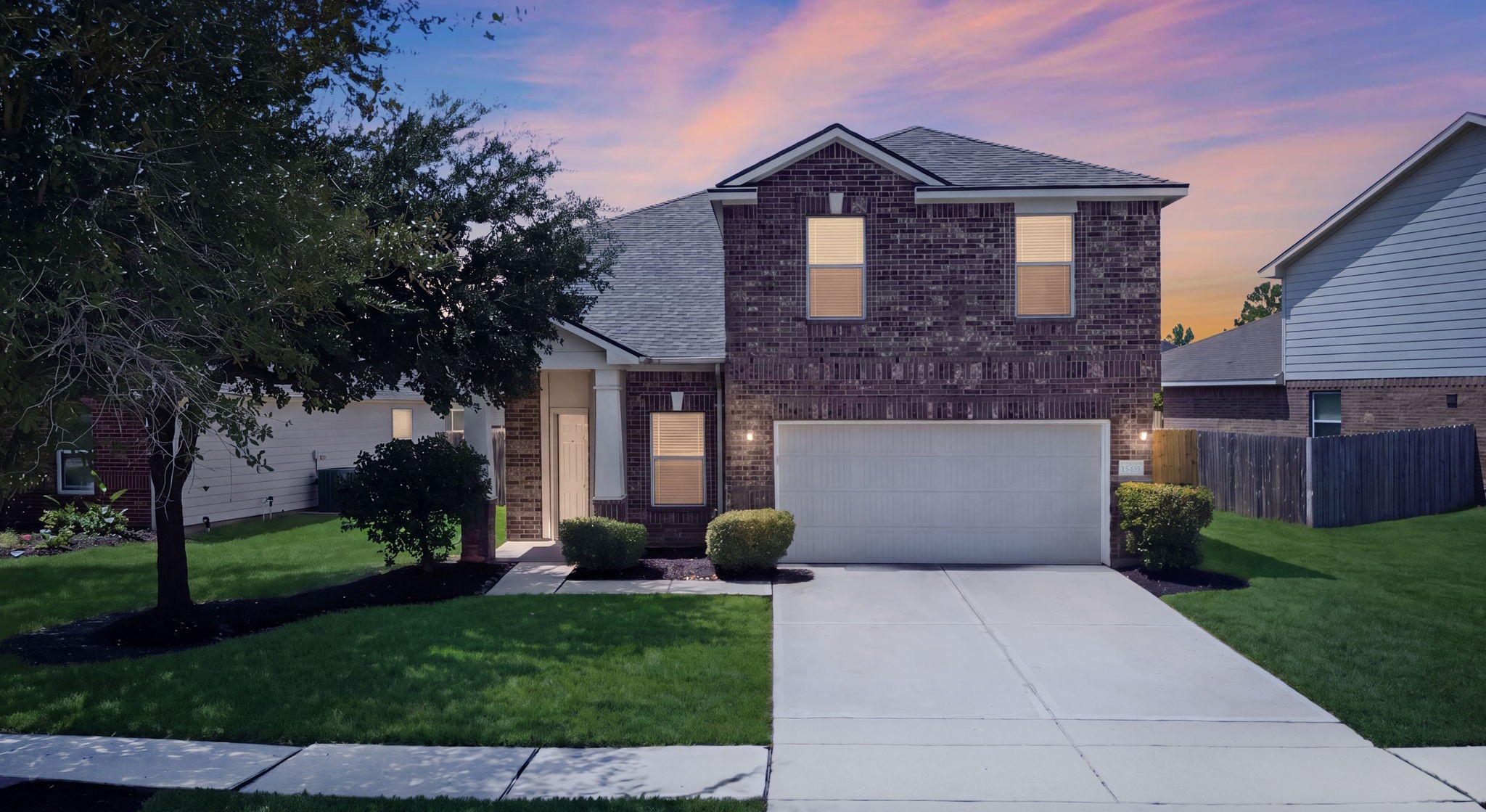 Welcome to 15435 Kaston Dr, a updated two-story Cypress Landing home boasting a classic brick exterior, 2-car garage, and wide driveway.