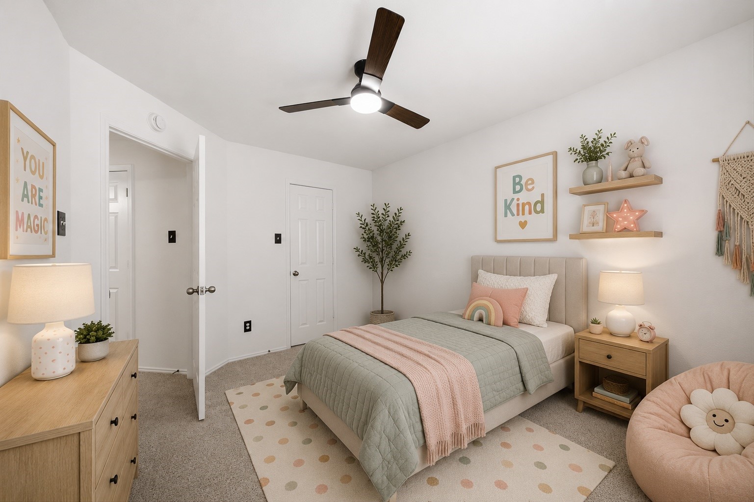 Soft neutral carpet and a modern dark-blade ceiling fan complement the crisp white walls in this secondary bedroom. A standard closet door sits adjacent to the entry hallway, while the versatile layout allows ample room for furnishings. This photo has been virtually staged.