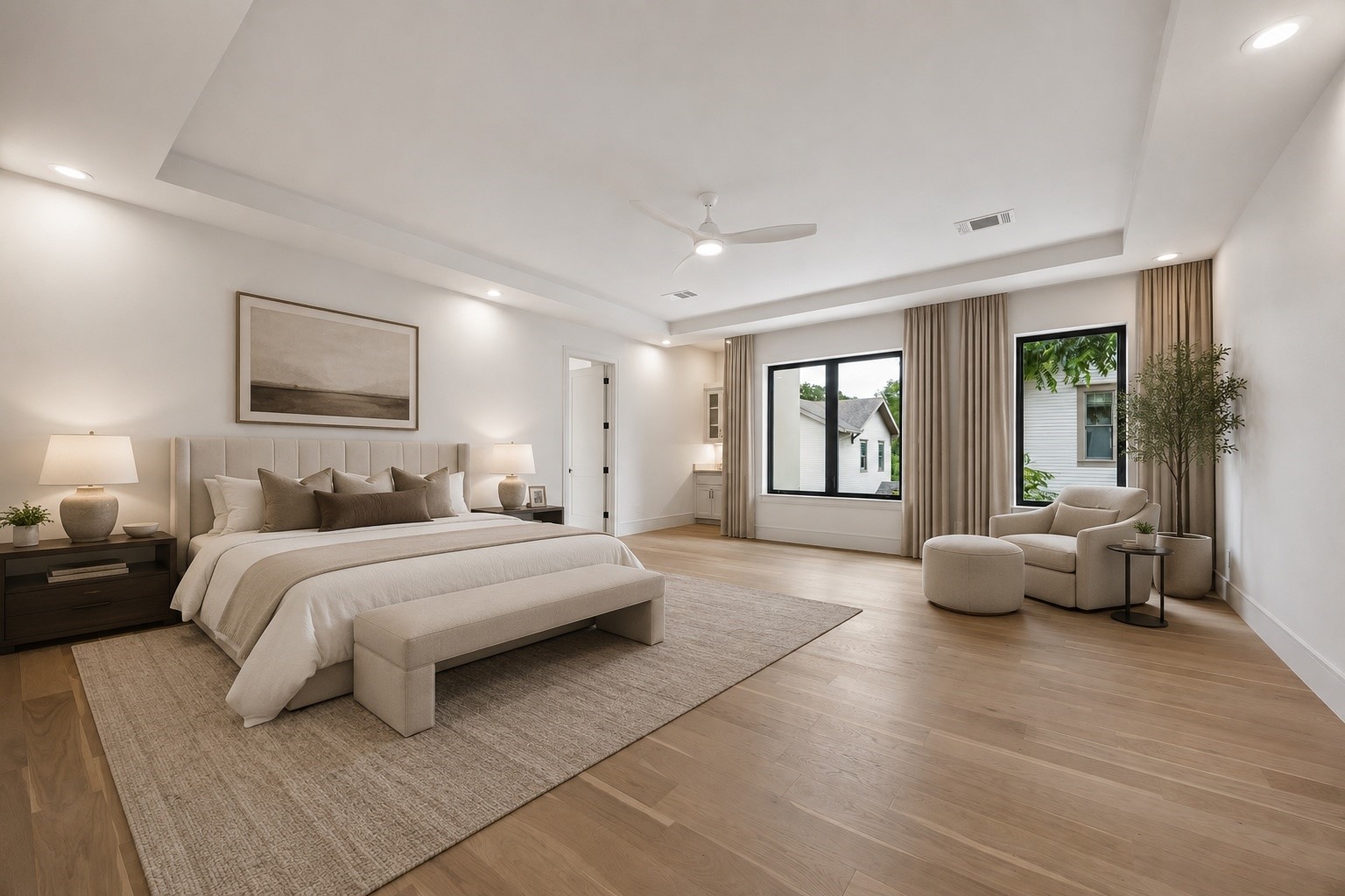 Designed as a true retreat, the expansive primary suite pairs soaring tray ceilings with full height windows and natural light. A sitting area and direct connection to the spa inspired primary bath create a peaceful escape, complete with its own dedicated AC unit. A discreet flex space behind the suite is pre-wired for AV termination - ready as a media closet, hardwired security/camera room, or private gun room, if desired. **Virtually staged**
