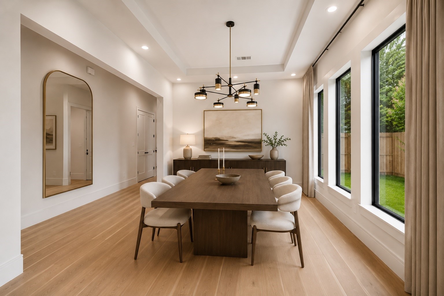 Natural light pours through oversized windows, highlighting soaring ceilings and creating an elegant backdrop for everyday dining and effortless entertaining. Positioned just off the main living spaces, the room offers a seamless flow while maintaining a refined sense of occasion. **Virtually staged** Natural light pours through oversized windows, highlighting soaring ceilings and creating an elegant backdrop for everyday dining and effortless entertaining. Positioned just off the main living spaces, the room offers a seamless flow while maintaining a refined sense of occasion. **Virtually staged**