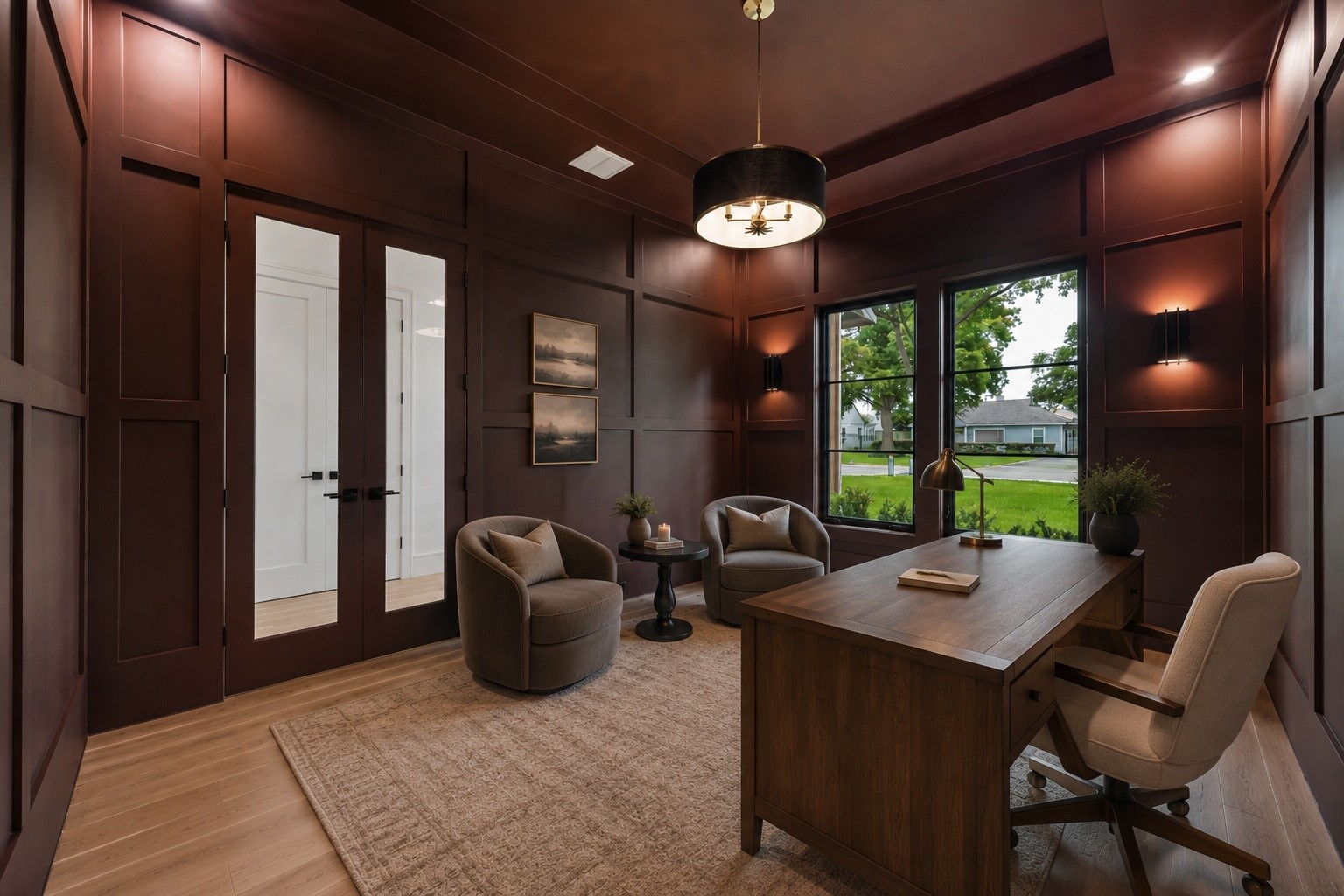 Rich millwork, dramatic ceiling height, and designer lighting create a refined home office designed to inspire. Oversized windows welcome natural light, while the flexible layout offers the perfect balance of productivity and a comfortable place to meet, read, or unwind. **Virtually staged**