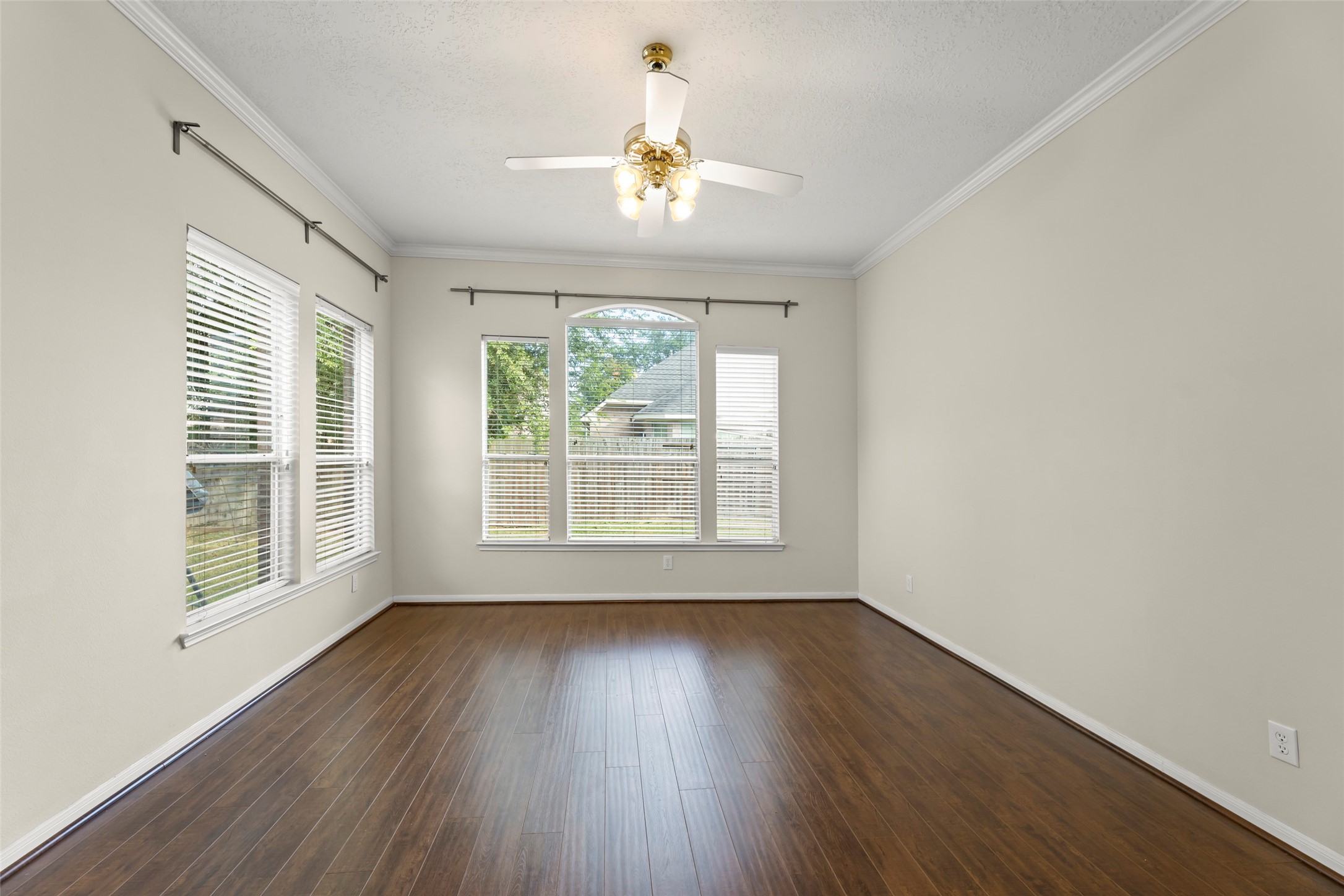 Master bedroom overlooks backyard.