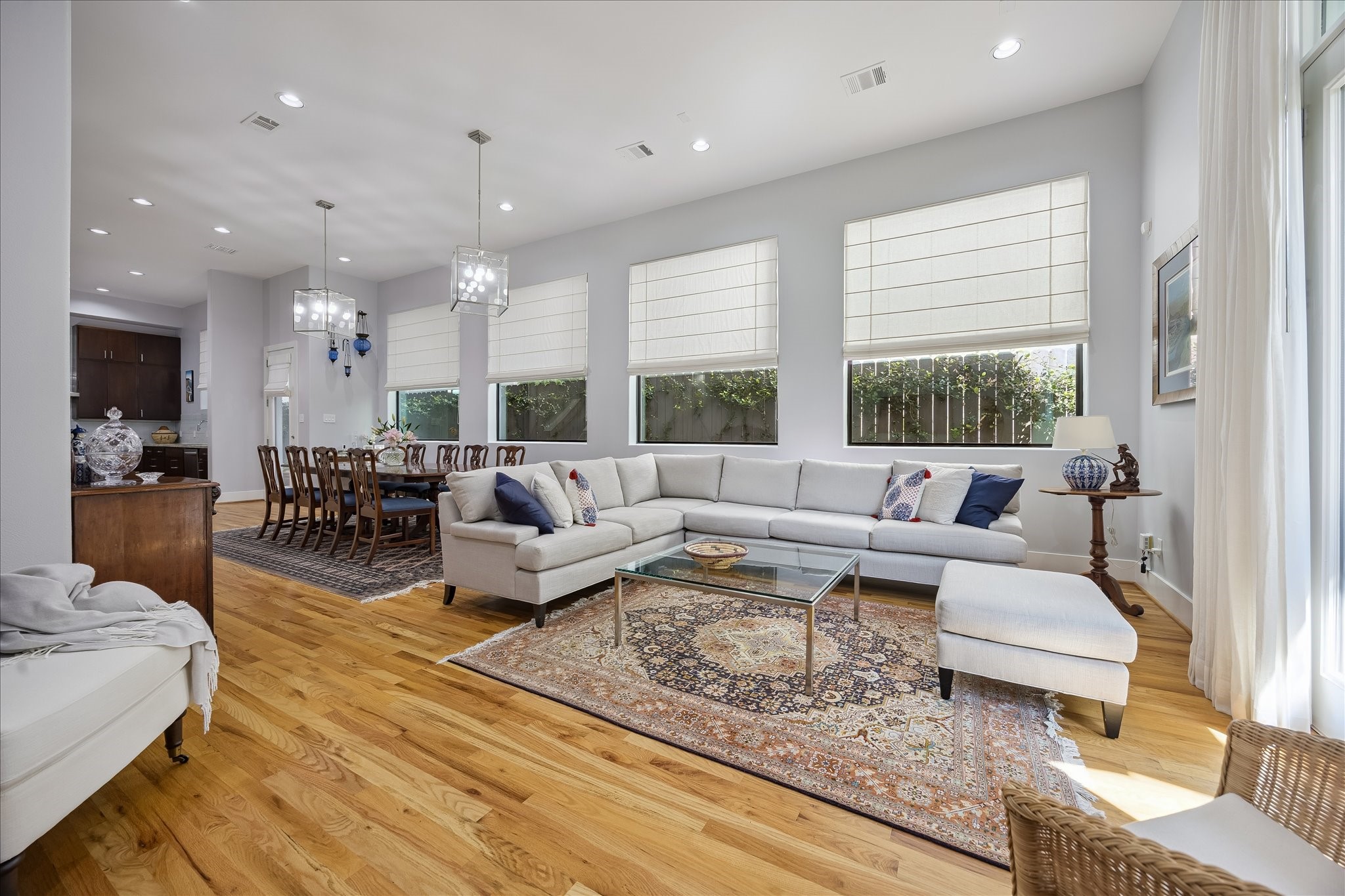 Another view of the living room and dining room with its beautiful wood floors, substantial windows and designer window treatments. Another view of the living room and dining room with its beautiful wood floors, substantial windows and designer window treatments.