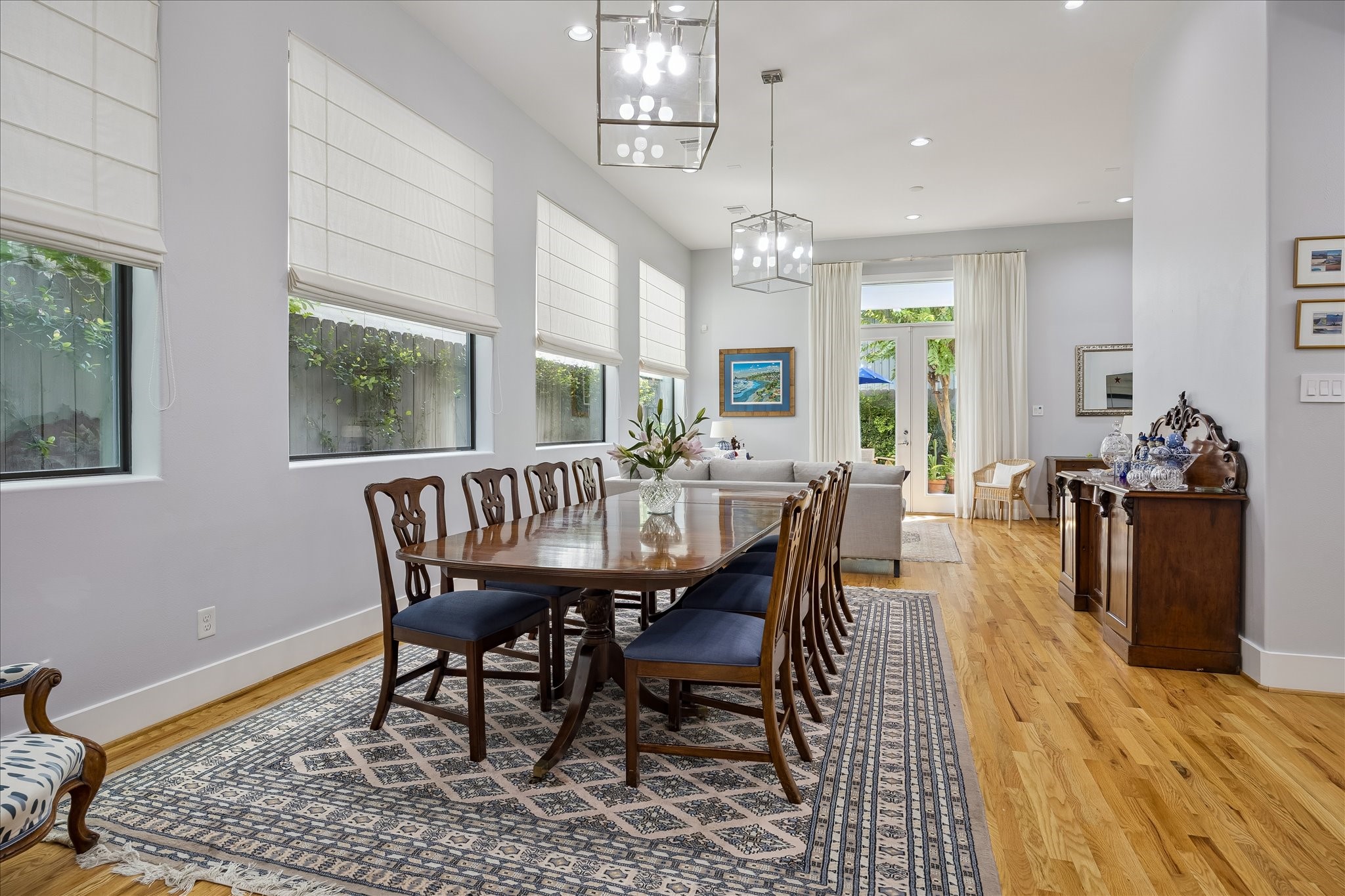 The elegant DINING ROOM is conveniently located between the kitchen and living room perfect for easy entertaining. Large picture windows offer an abundance of natural light while still allowing complete privacy. The elegant DINING ROOM is conveniently located between the kitchen and living room perfect for easy entertaining. Large picture windows offer an abundance of natural light while still allowing complete privacy.