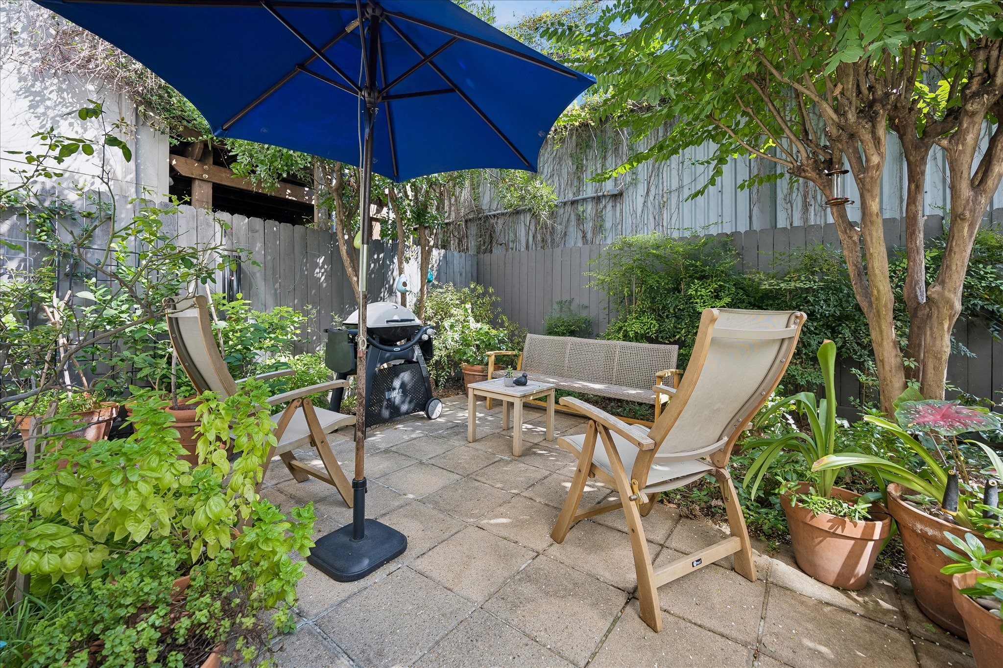 This private BACK PATIO with lush landscaping is a wonderful place to dine al fresco or enjoy your morning coffee. This private BACK PATIO with lush landscaping is a wonderful place to dine al fresco or enjoy your morning coffee.