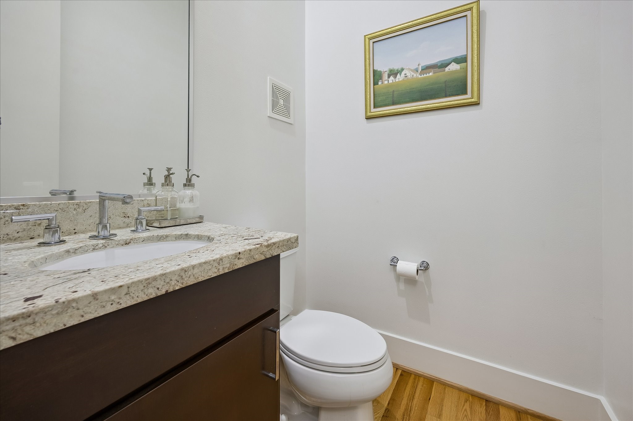 POWDER ROOM privately tucked away.
