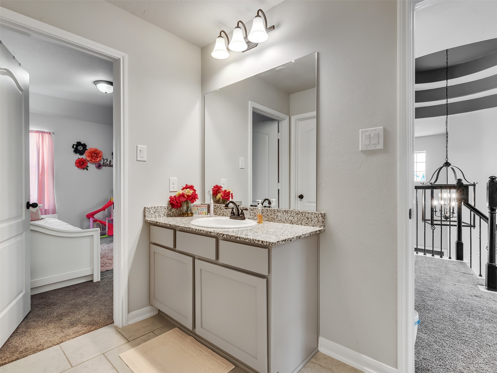 Another view of upstairs bathroom with dual vanities