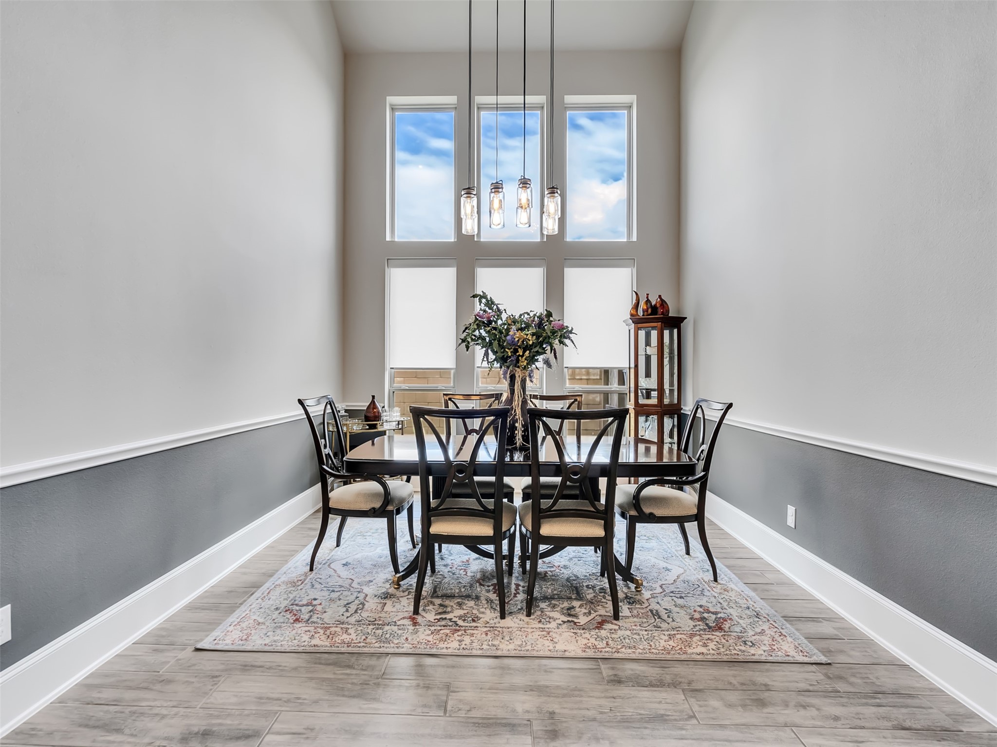 Dining room area with large windows and chair rail moldings accent this rooms inviting atmosphere. Dining room area with large windows and chair rail moldings accent this rooms inviting atmosphere.