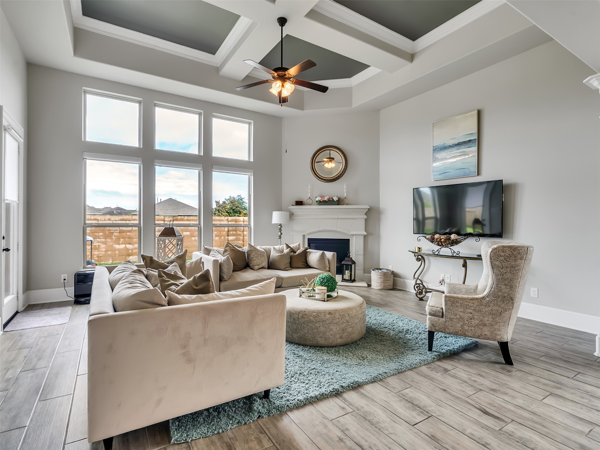 The natural lighting, gas fireplace, and tile flooring makes this Family room shine.