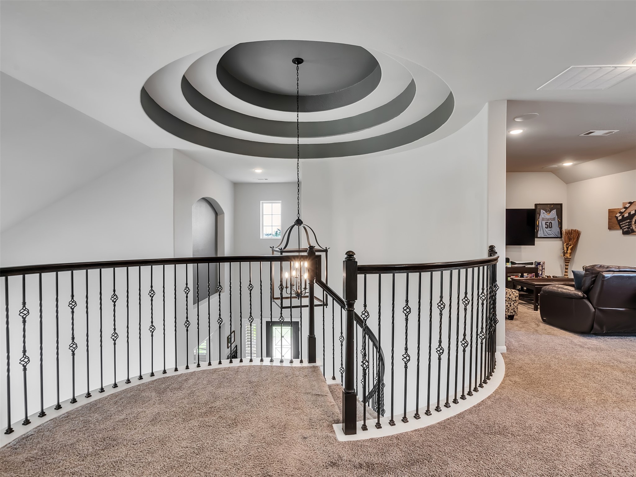 Upstairs loft area showing the detailed tray ceilings