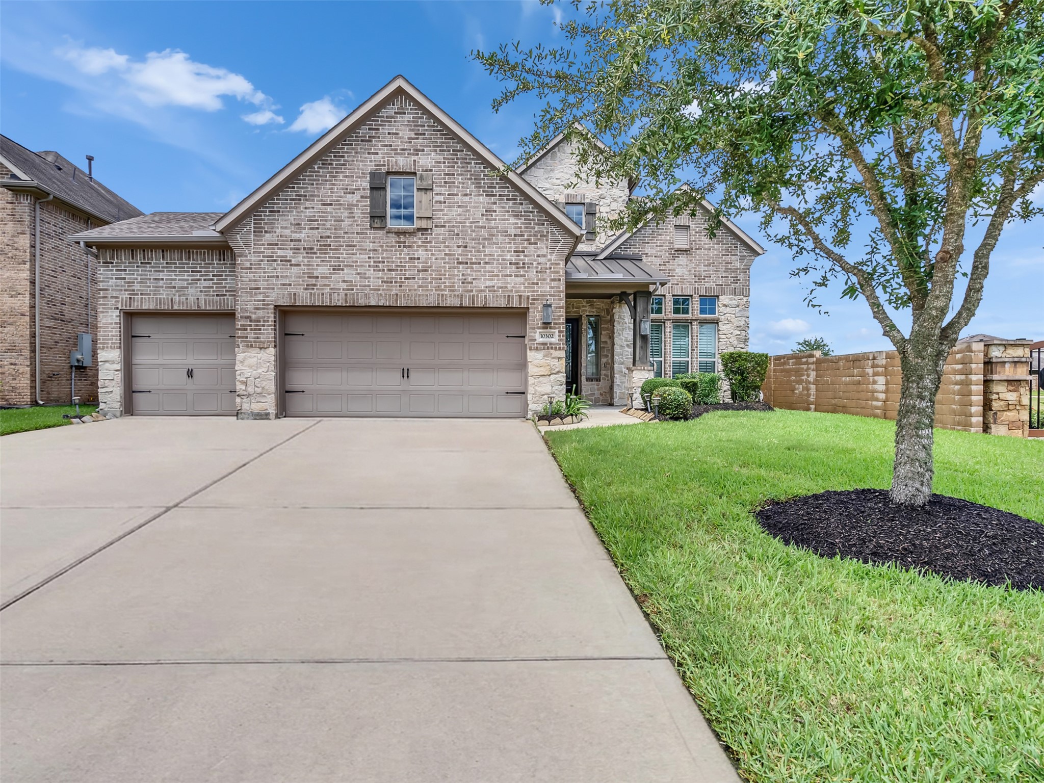 Charming two-story brick and stone home with a well-maintained front yard, attached 3-car garage, and welcoming entryway. Charming two-story brick and stone home with a well-maintained front yard, attached 3-car garage, and welcoming entryway.