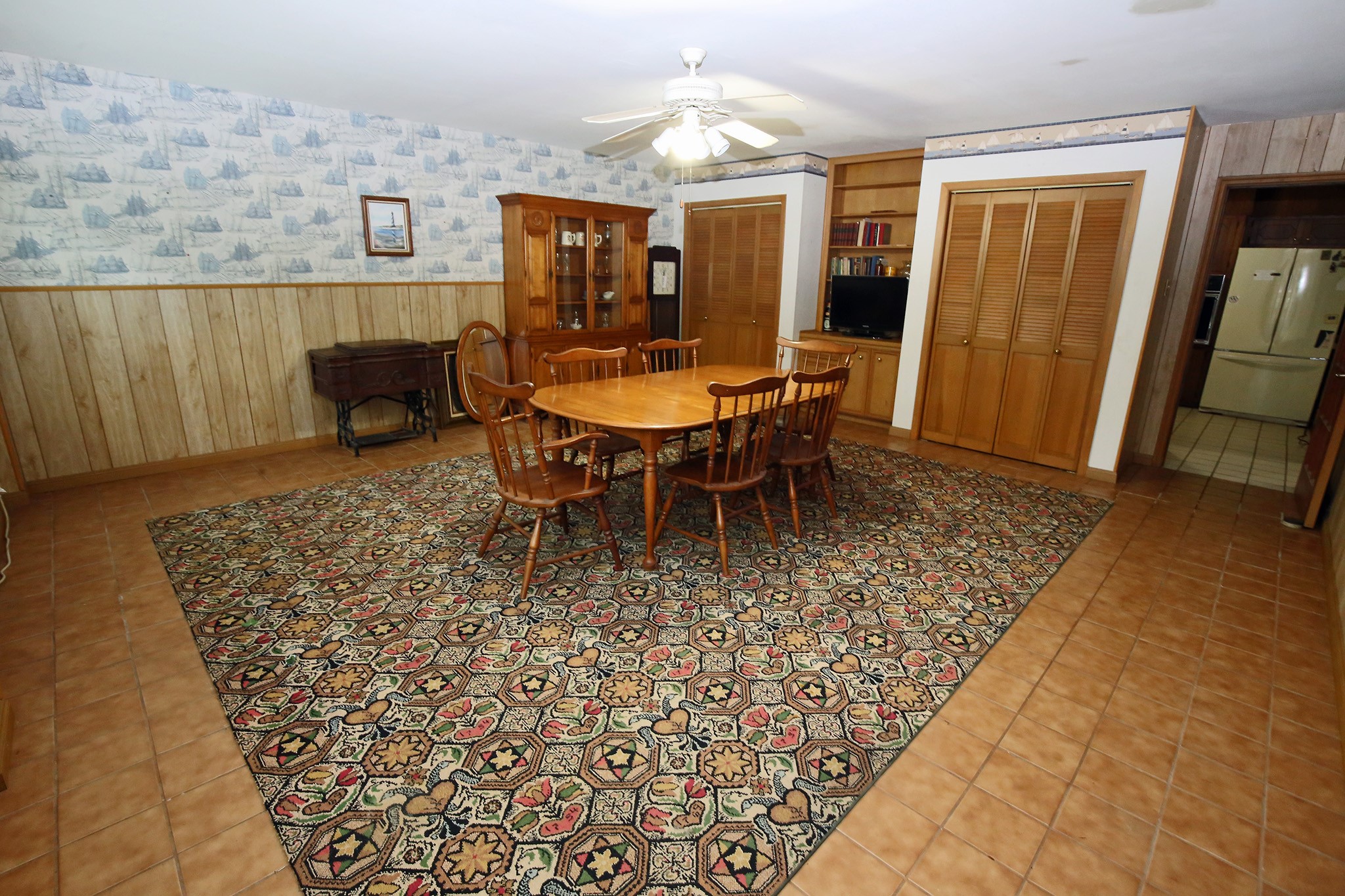 Spacious flex room ideal for dining, a play area, or a cozy game room for the kids.