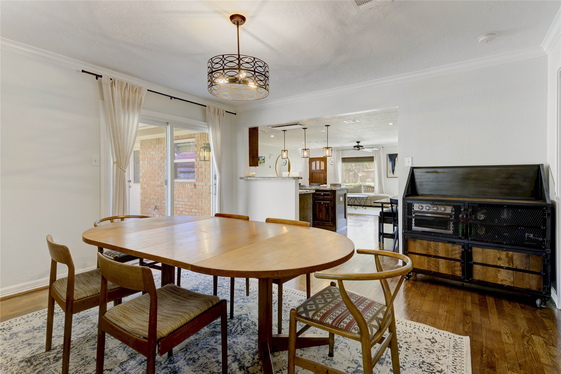 Between the kitchen and primary bedroom sits a dining room or extra space that offers a multitude of uses. With a sliding glass door to the patio, the options are endless.
