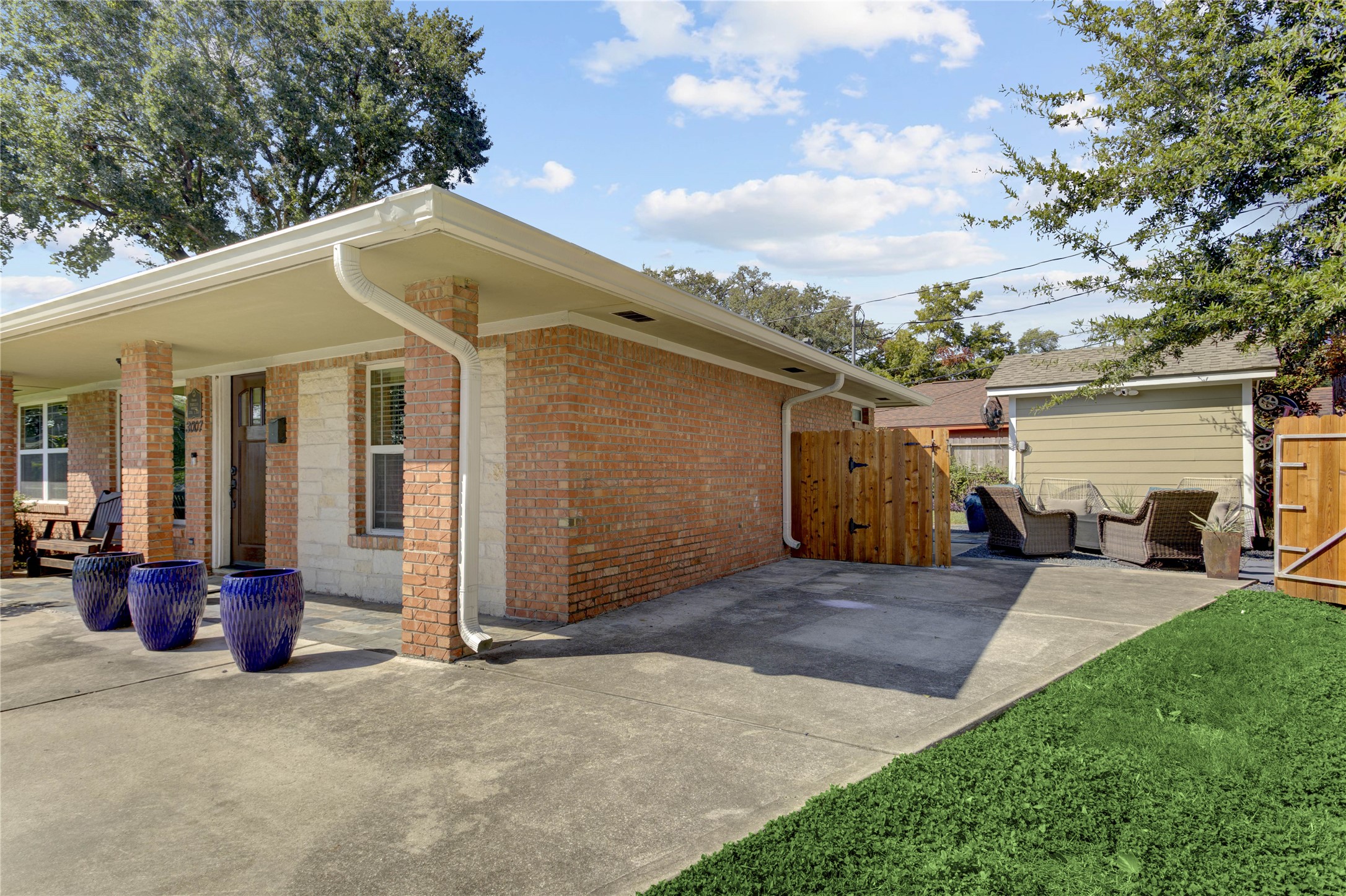 Another angle of the driveway/parking space leading to the backyard.