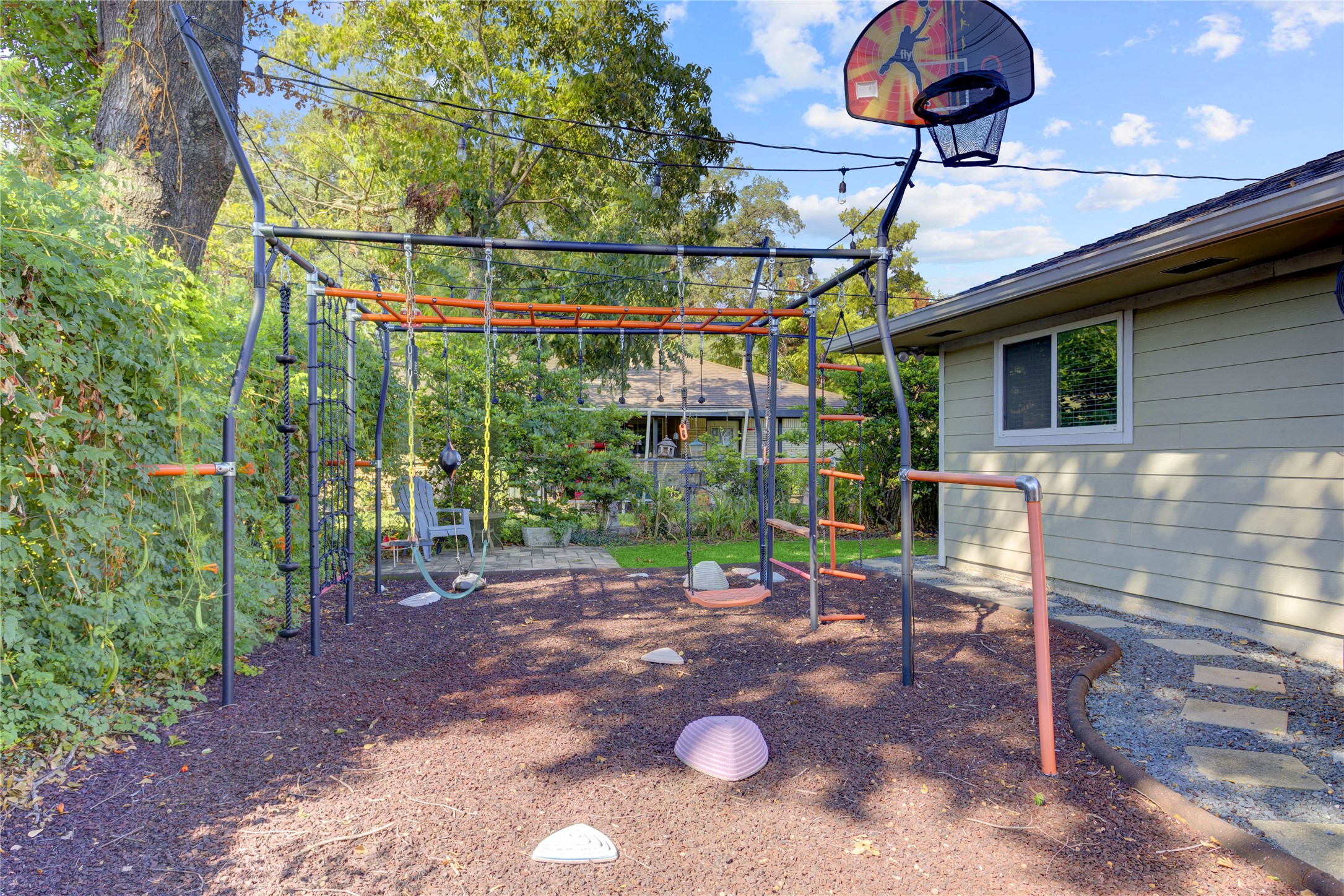 On the other side of the house sits another side yard, perfect for a playset like this. This playset is negotiable but planned to be taken by the sellers.