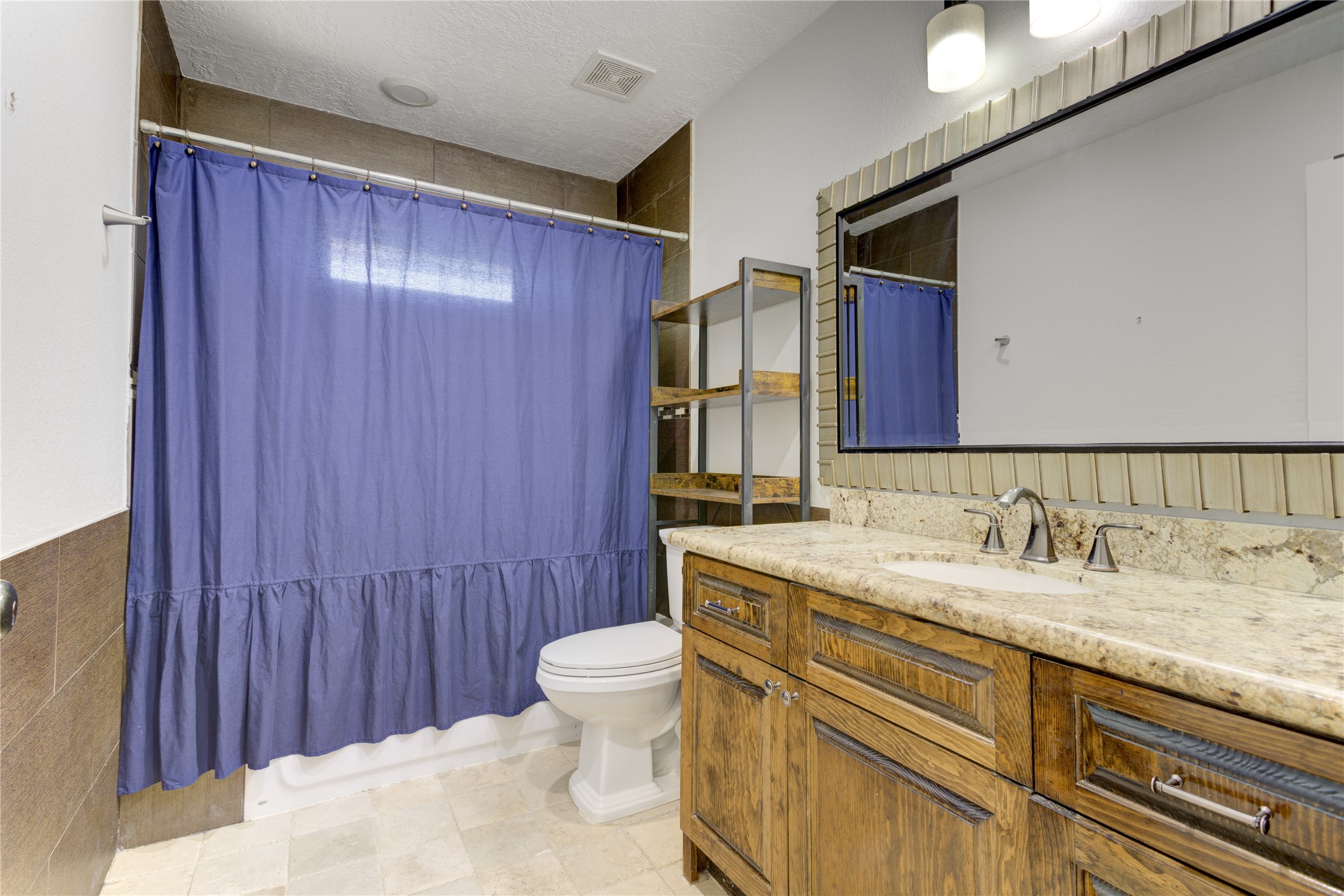 Located just outside of each secondary bedroom are full bathrooms with tub/shower combos.