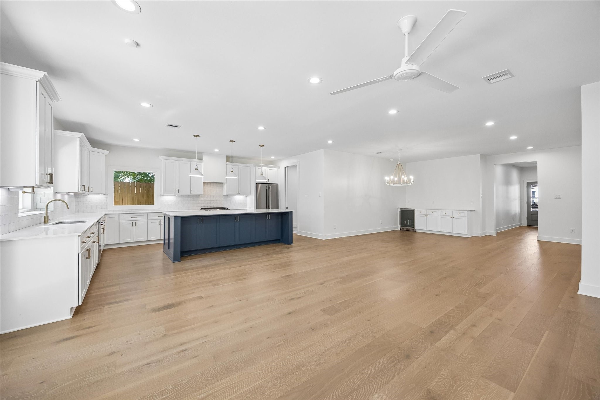 Seamless open-concept design, connecting the living area to the kitchen and dining spaces. The generous layout promotes effortless movement and interaction, ideal for hosting gatherings or enjoying family time.
