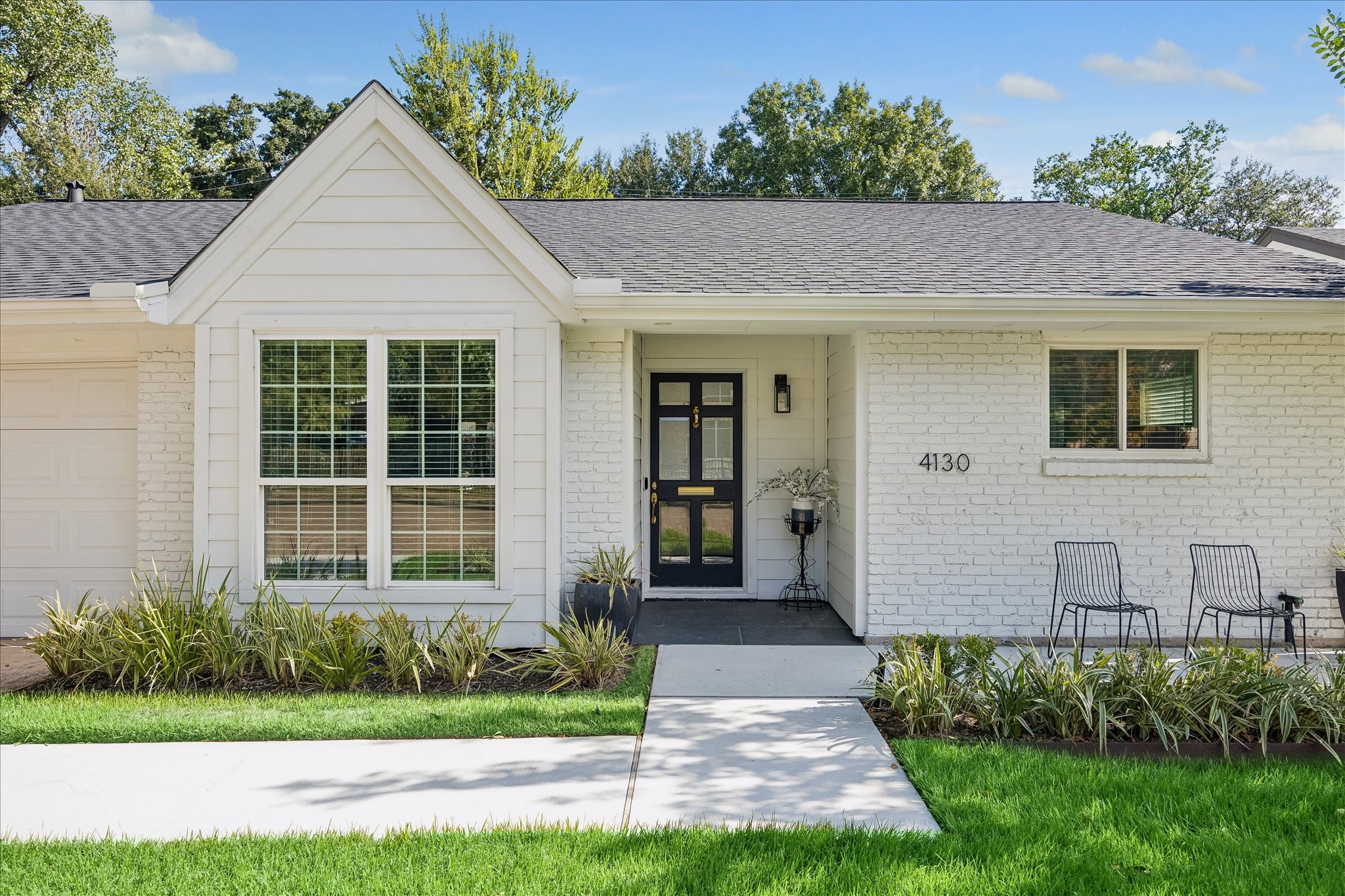 A charming front gable and recessed entry add architectural interest to the home's timeless exterior.
