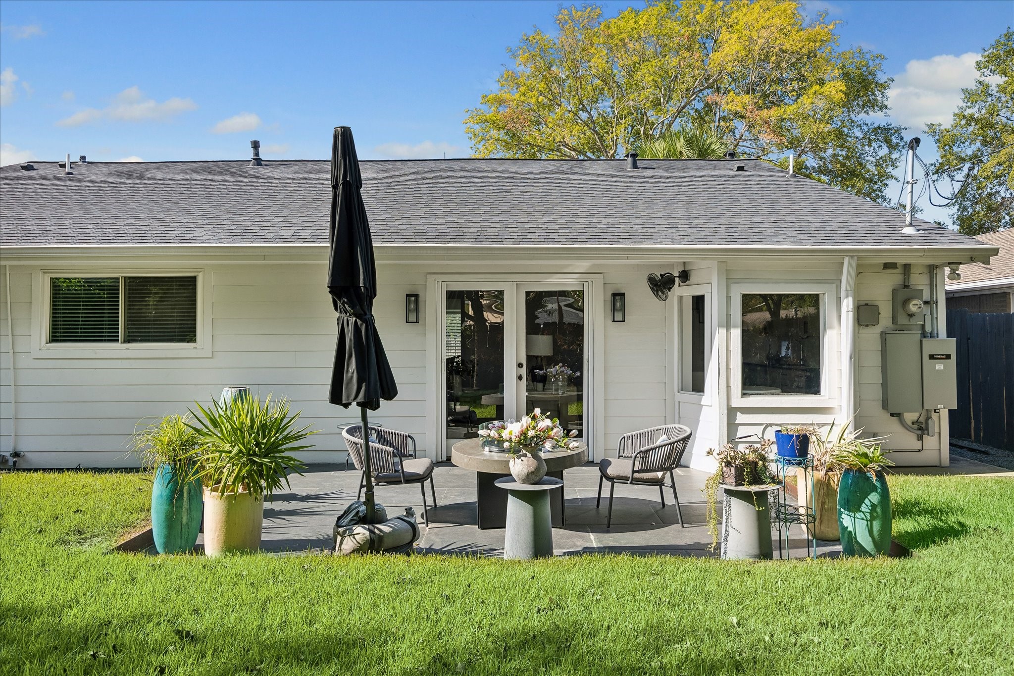 French doors open from the family room to an inviting patio, creating a natural extension of the home's living spaces.
