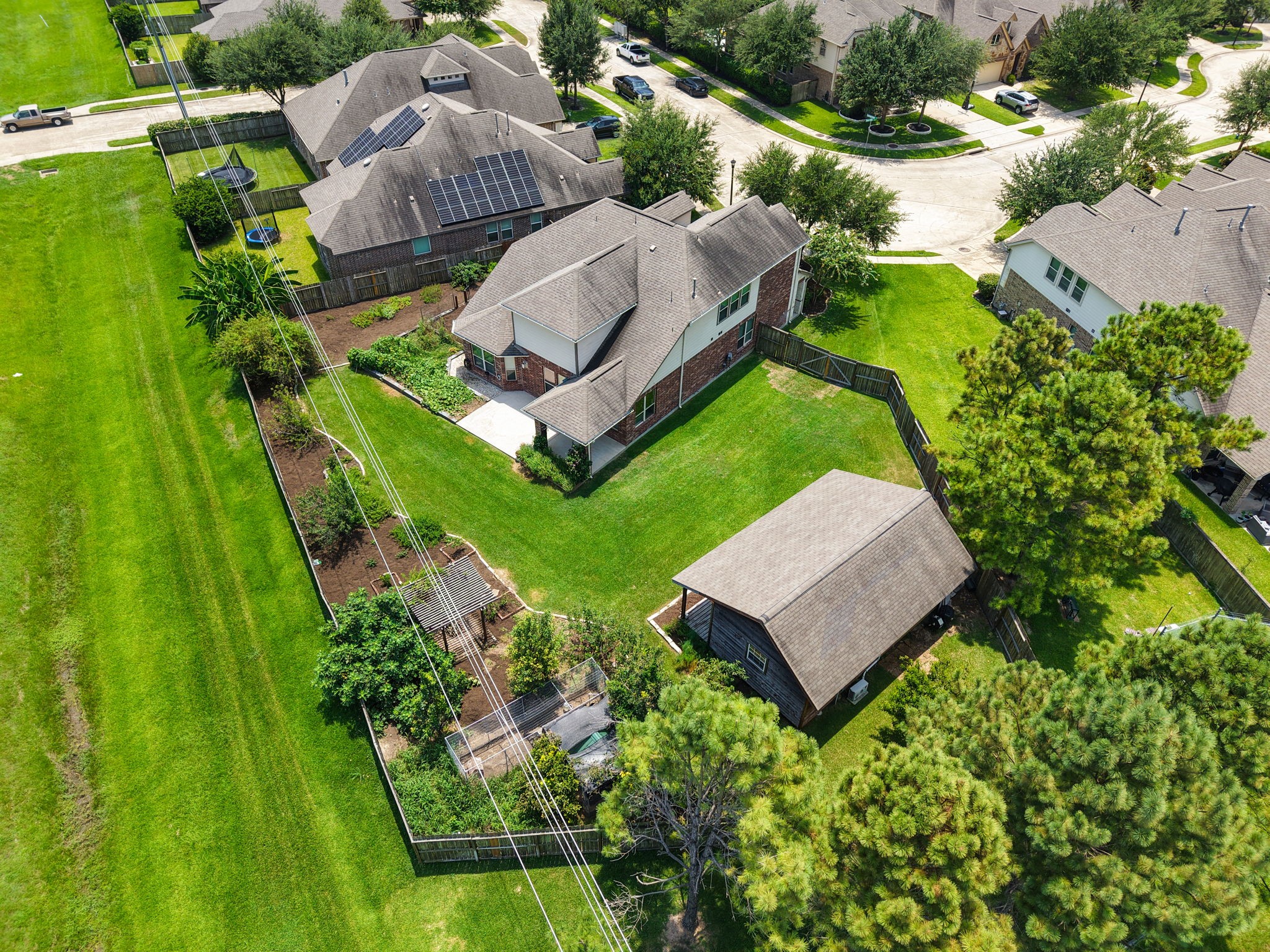 There are no immediate neighbors behind or to the left of the property.