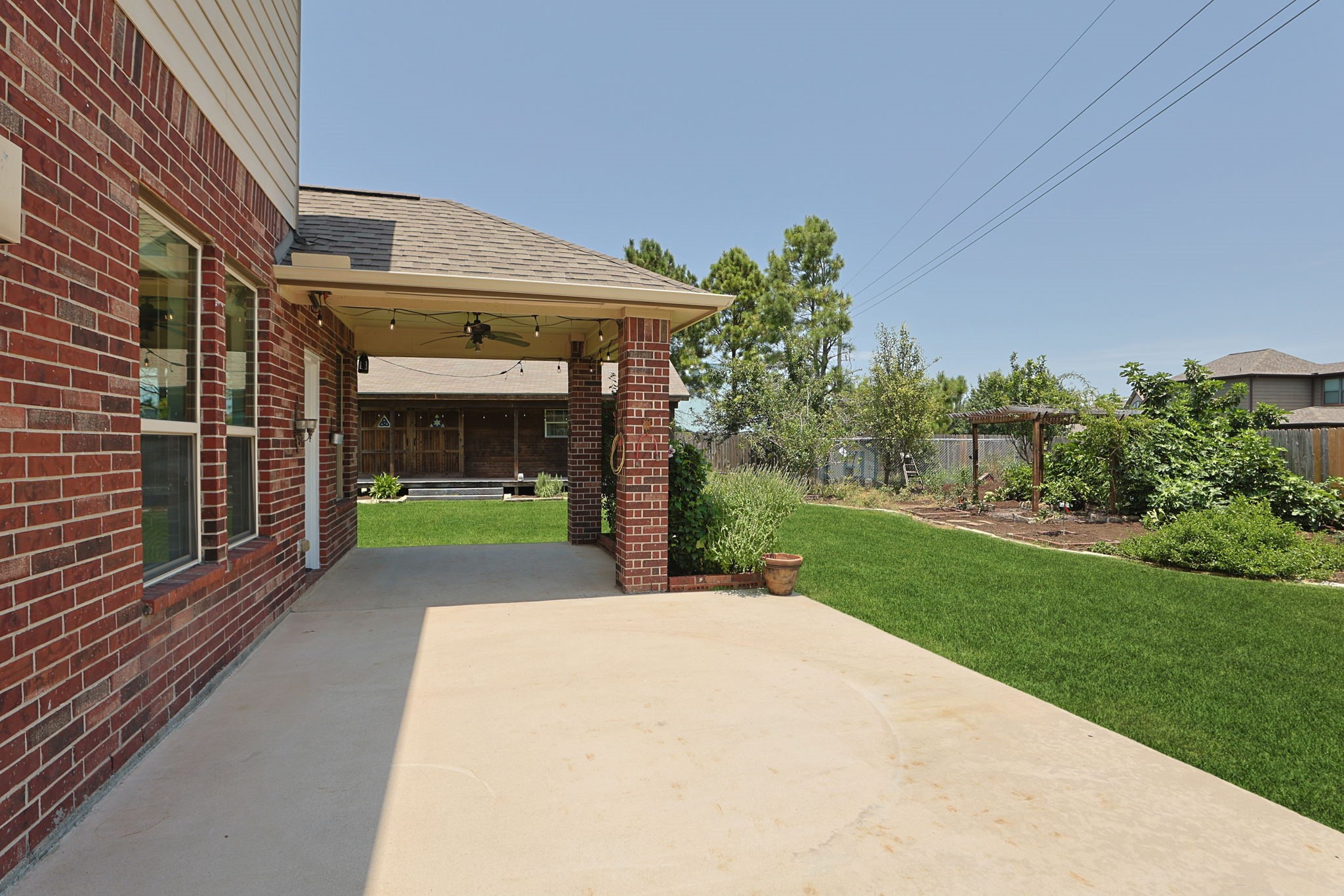 There is a large patio space off of the kitchen.  Part is covered and the other section is wired for a jacuzzi!