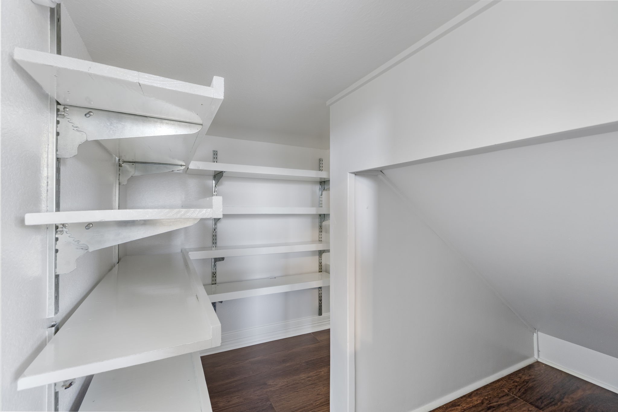 The seller extended storage under the staircase. This is the backside with a separate entrance door.