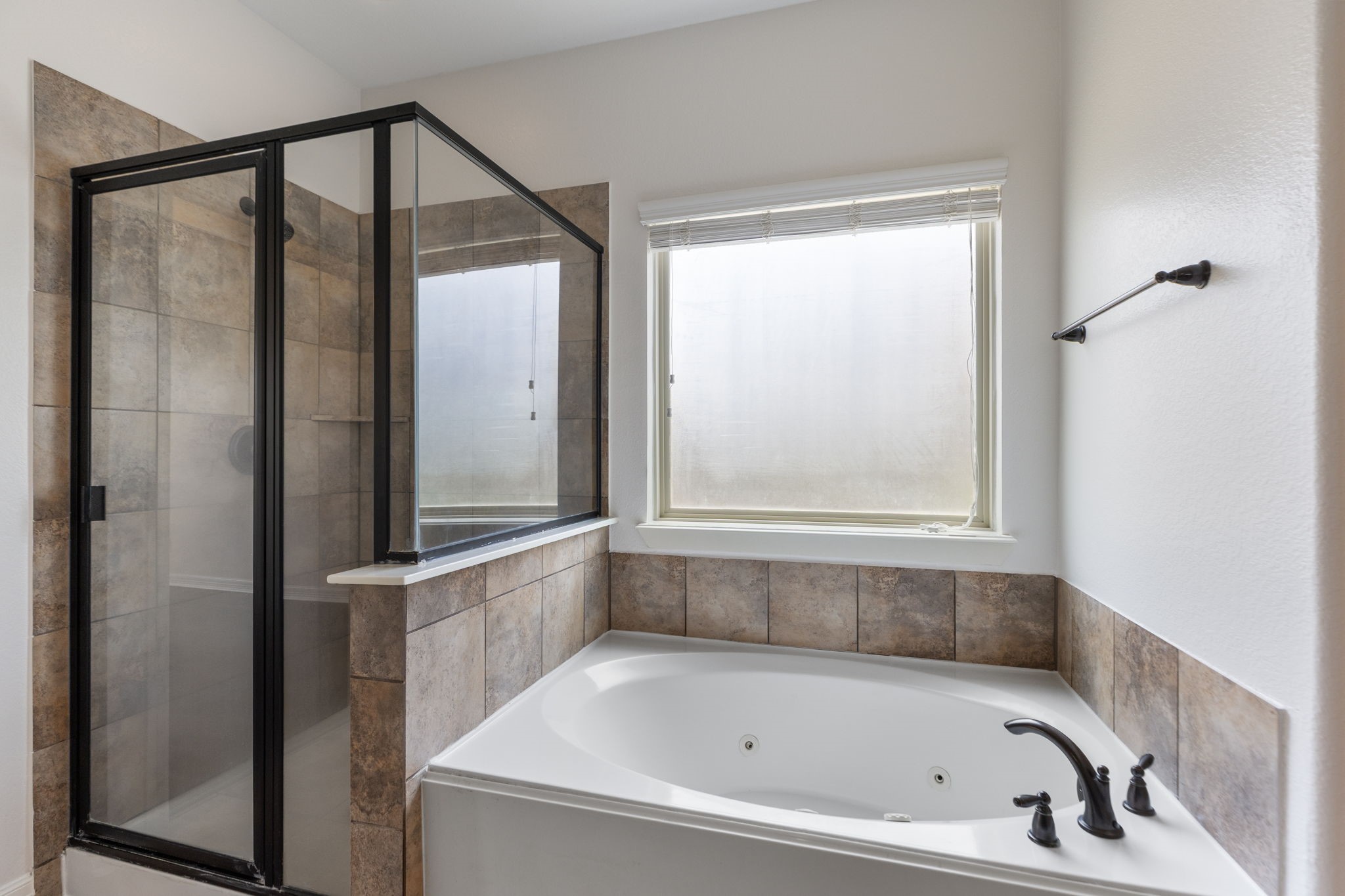 Separate shower and jacuzzi tub.