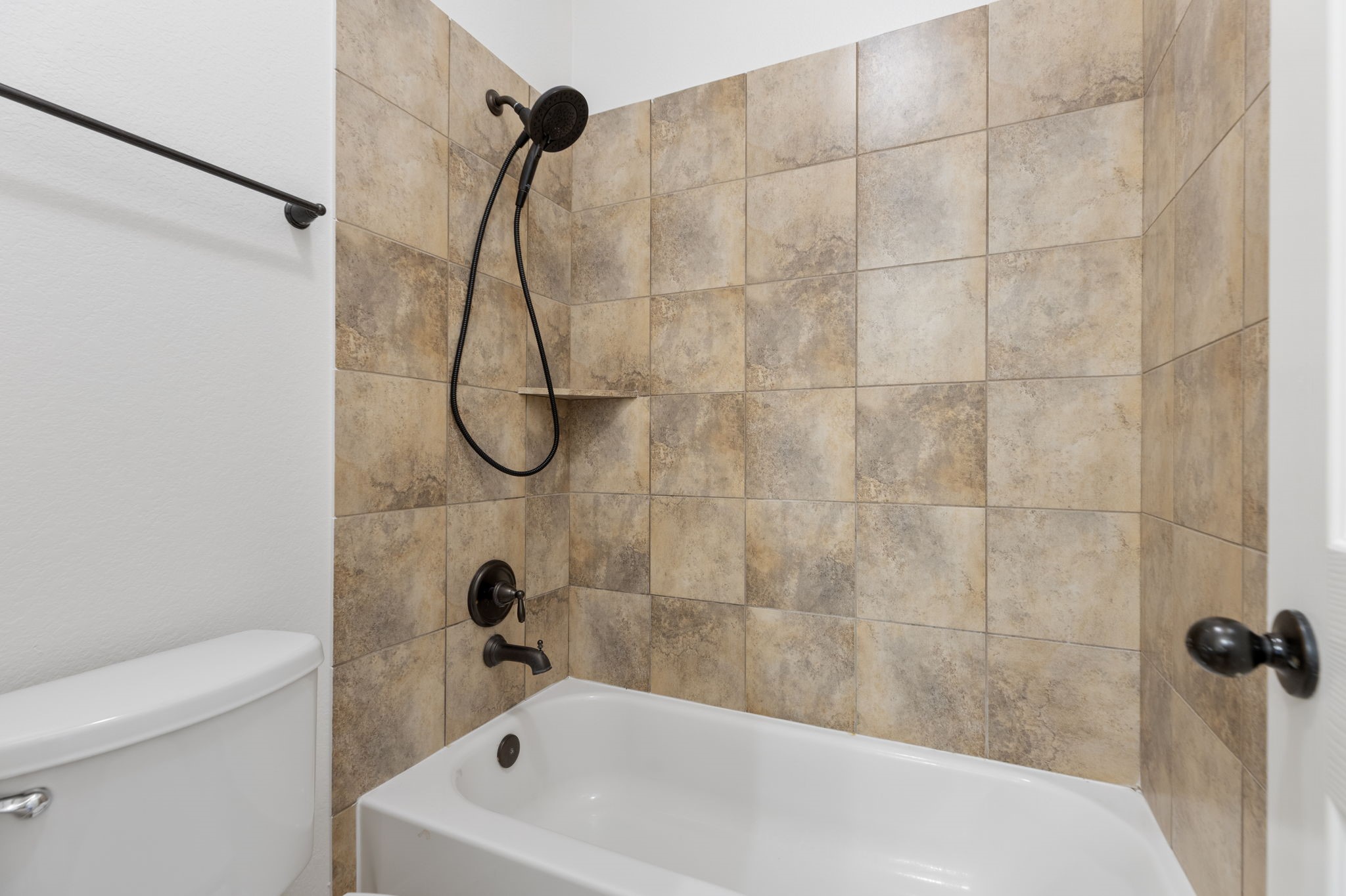 Shower area is separate from sink area.