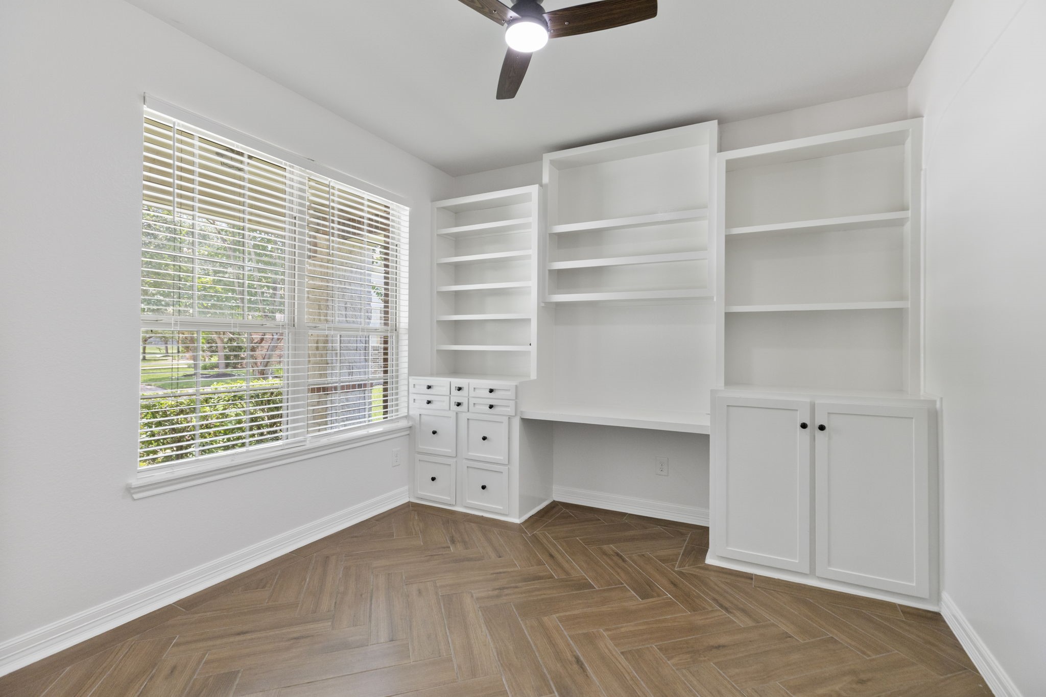 The office has built in book shelves, file drawers and desk. The office has built in book shelves, file drawers and desk.