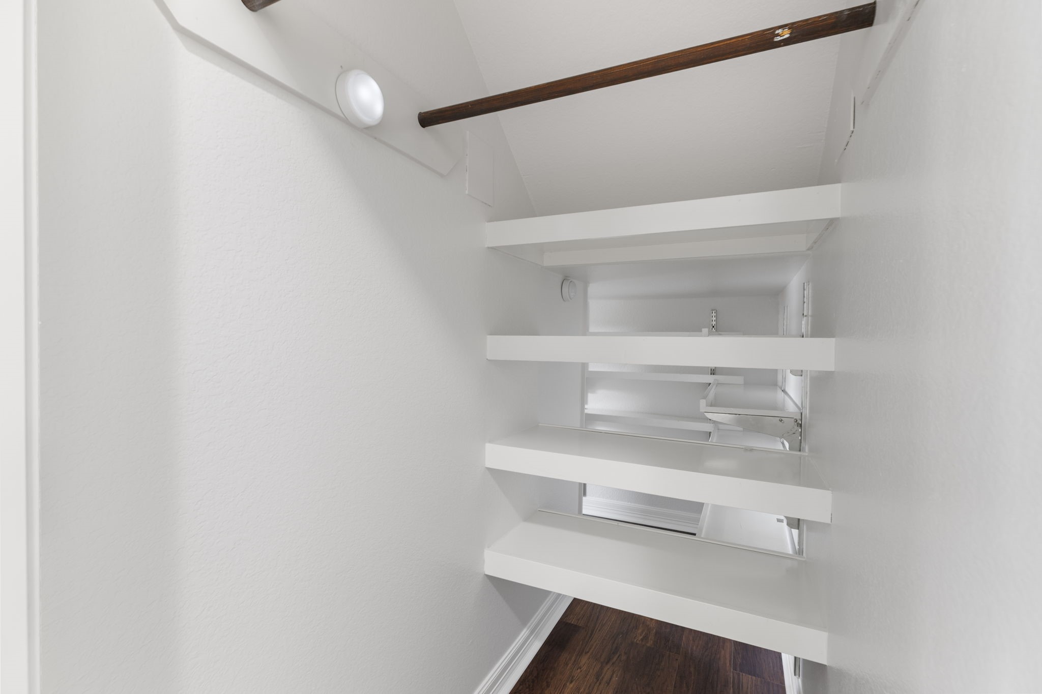 Front part of under the stairs Coat closet and storage.