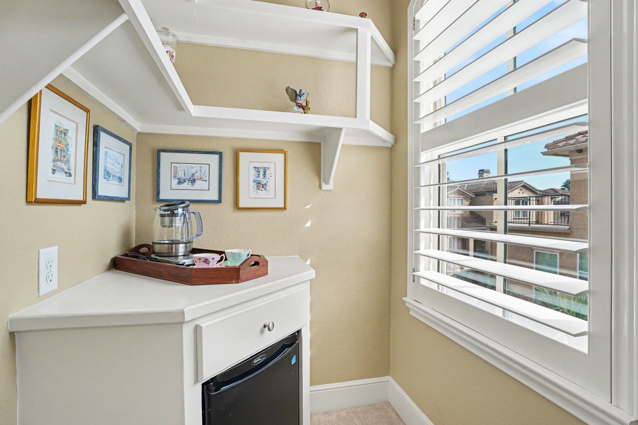 Coffee and refrigerator nook in primary bedroom