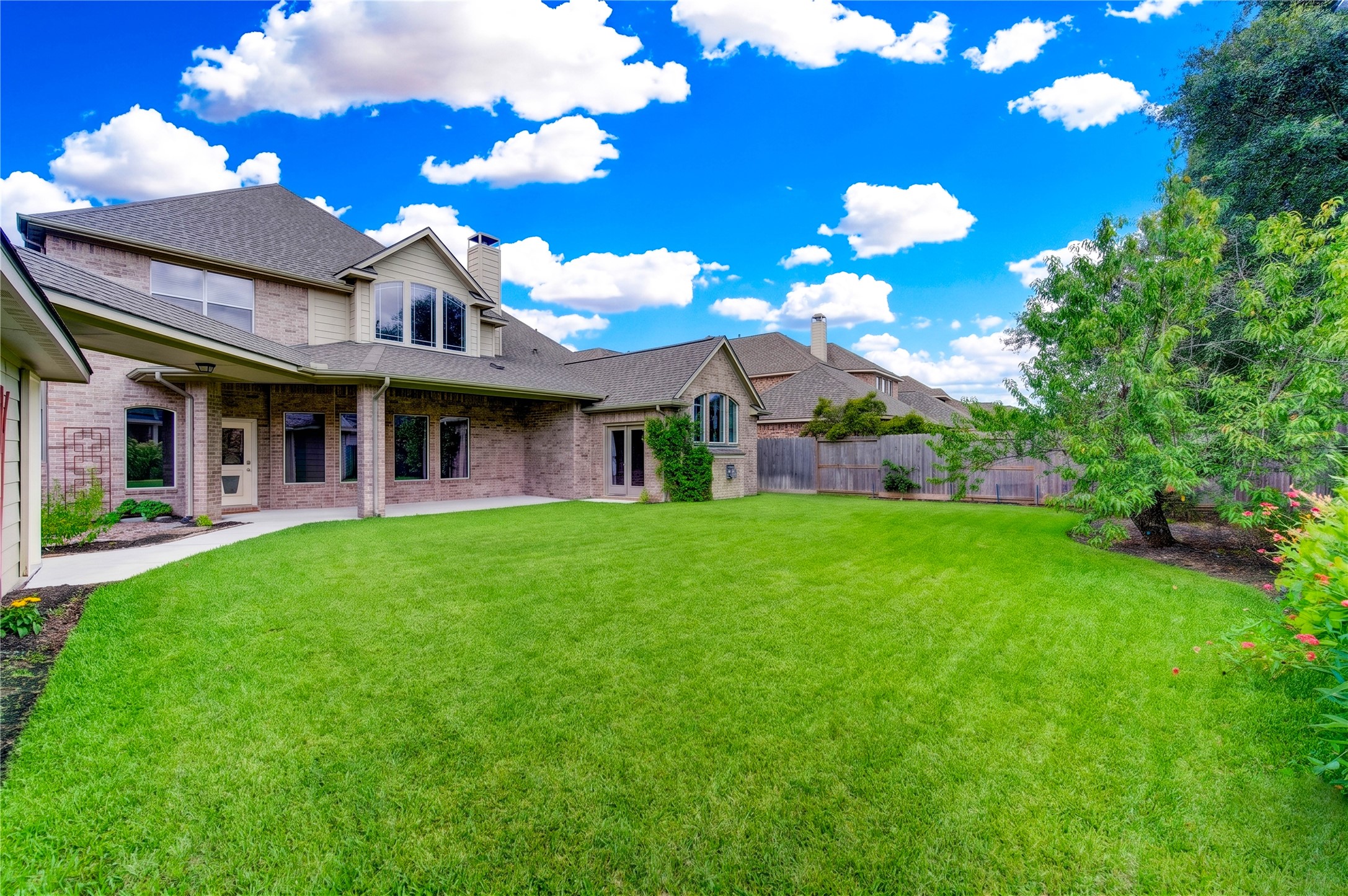 Enjoy Outdoor Living in This Spacious Backyard