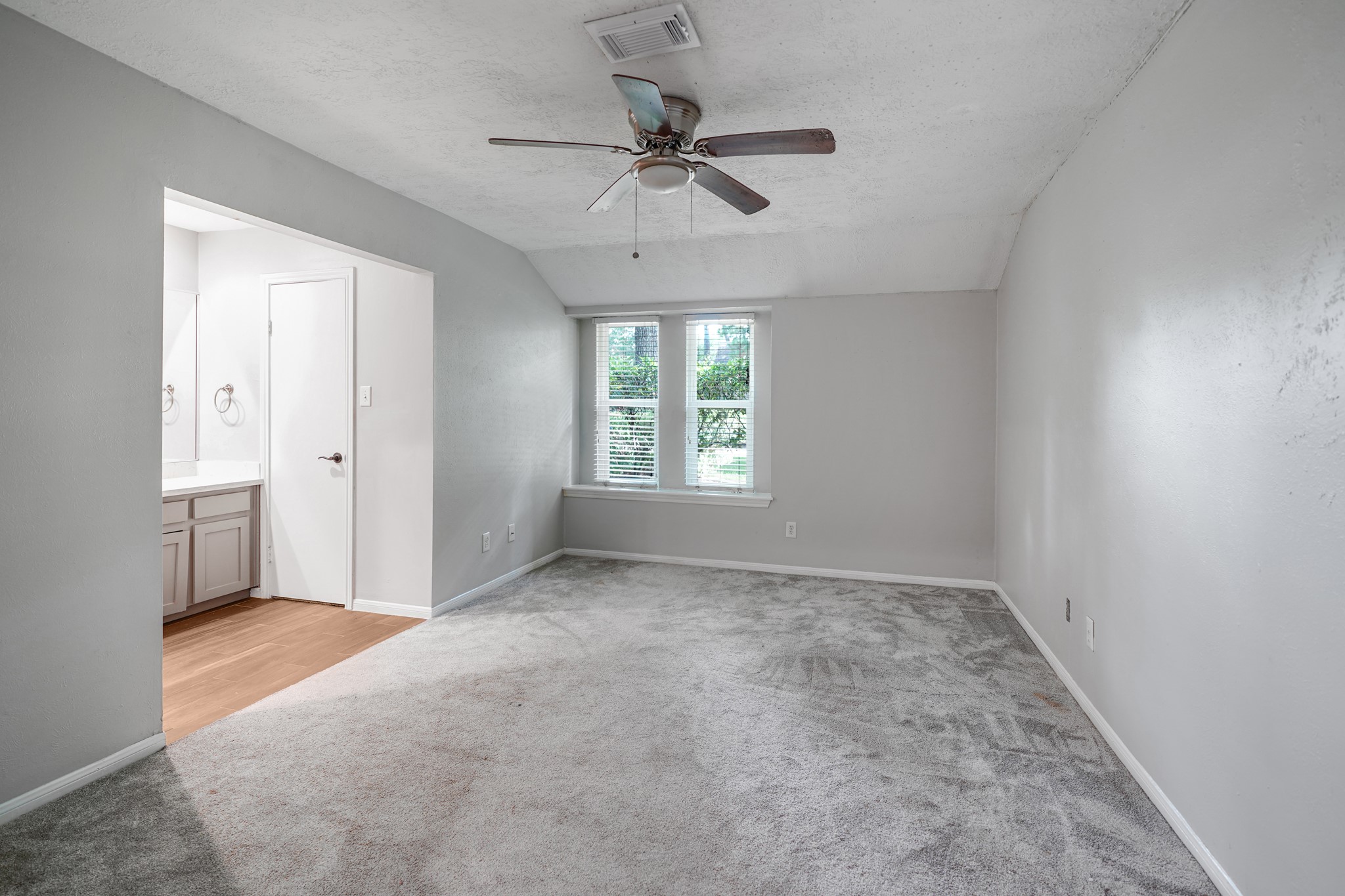 This is one of the two primary suites on the main level of this home.