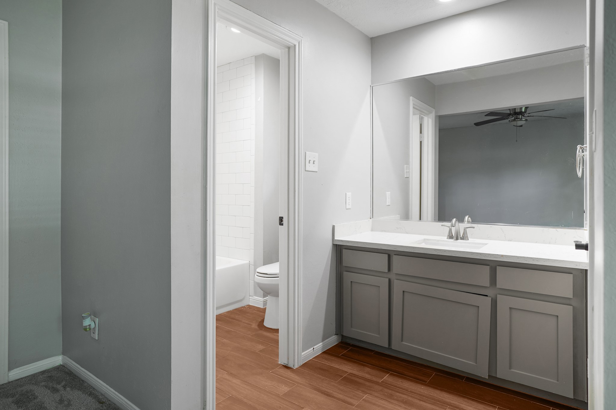 Full bath room attached to one of the two primary suites on main level.
