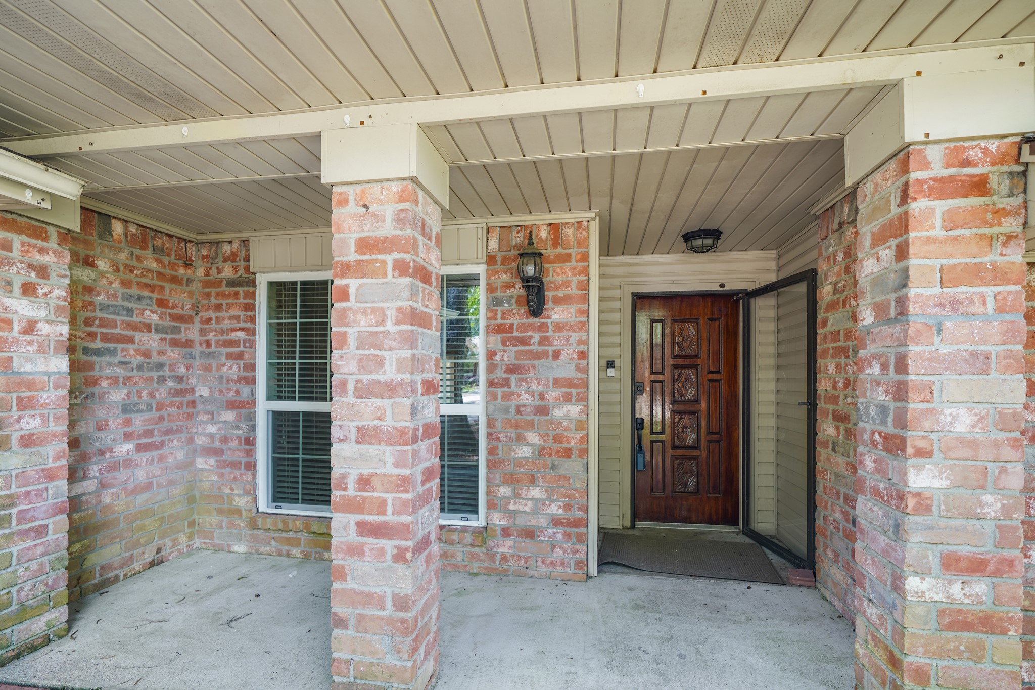 Deep front porch offers an inviting entry.