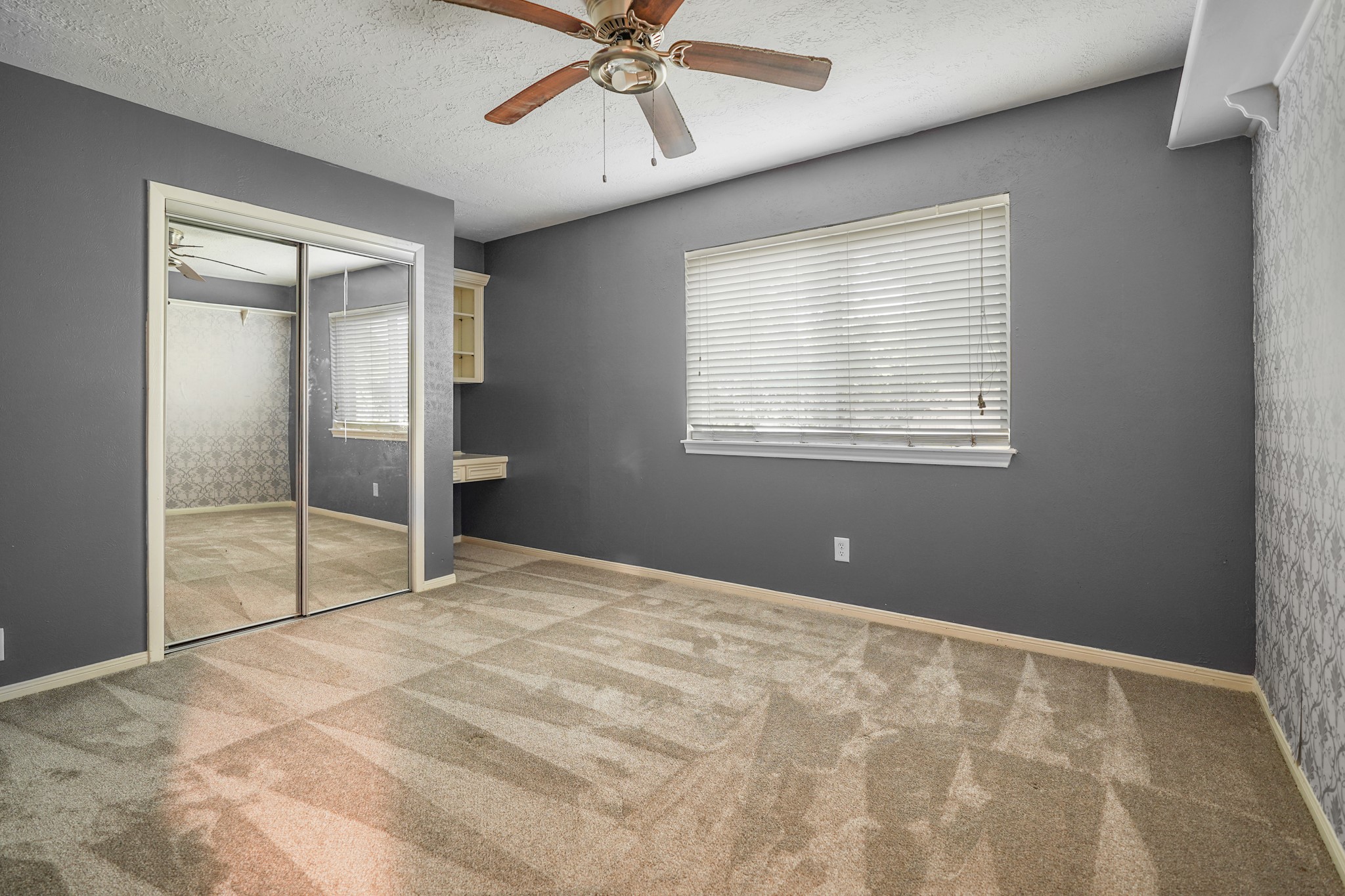 Third bedroom (not a primary) on the main level of the home.
