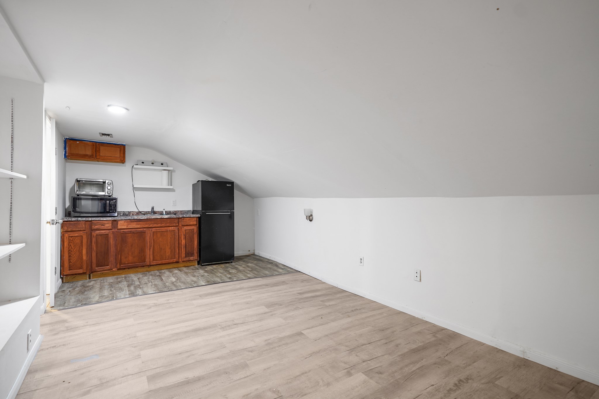 Upstairs apartment kitchen area and living room.