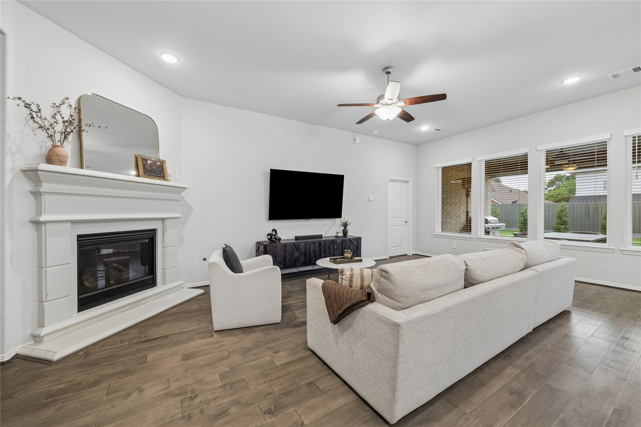 Gas-log fireplace, stone hearth. high ceilings.