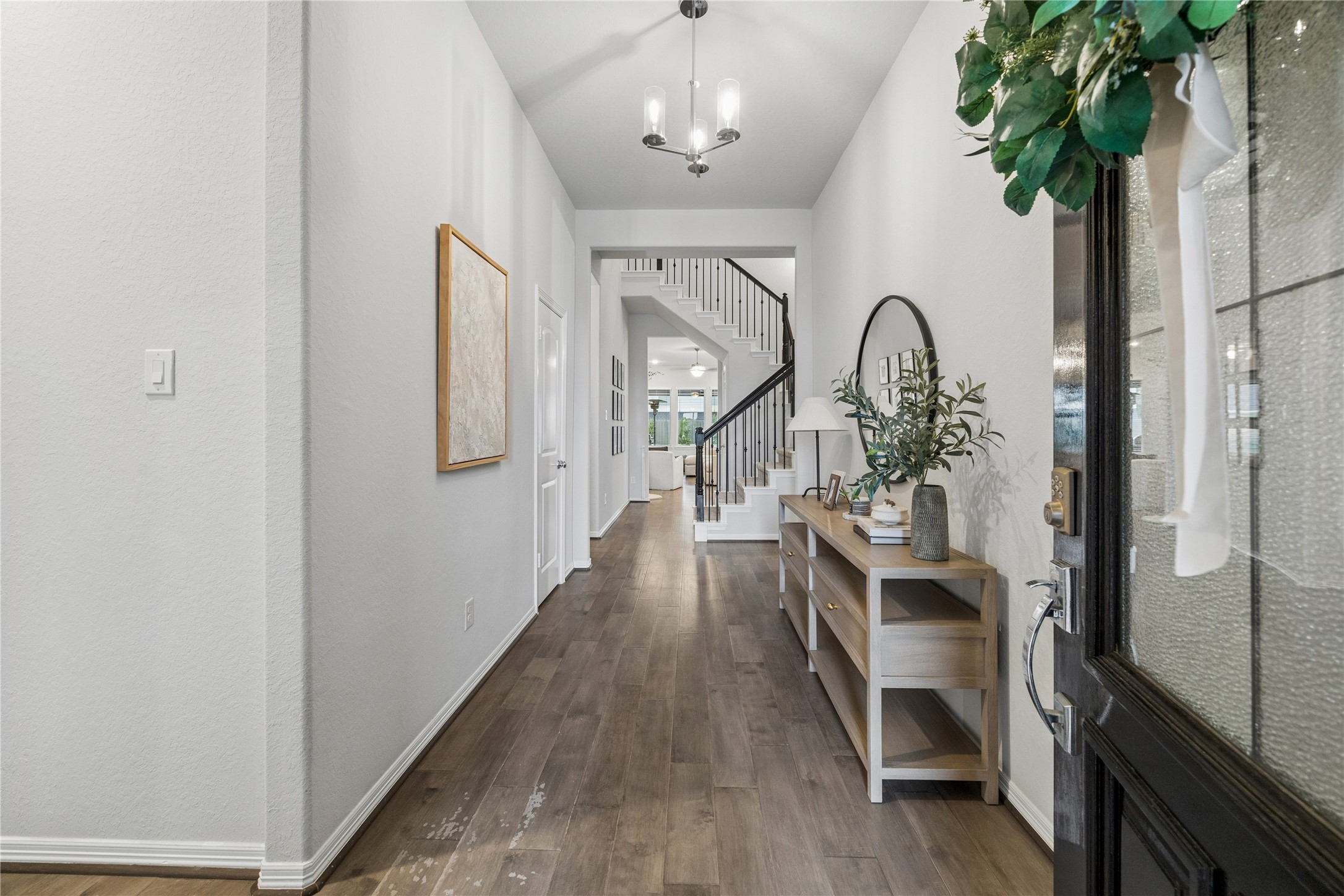 formal entry, tall ceilings, engineered wood floors, designer lighting, perfect dimensions.