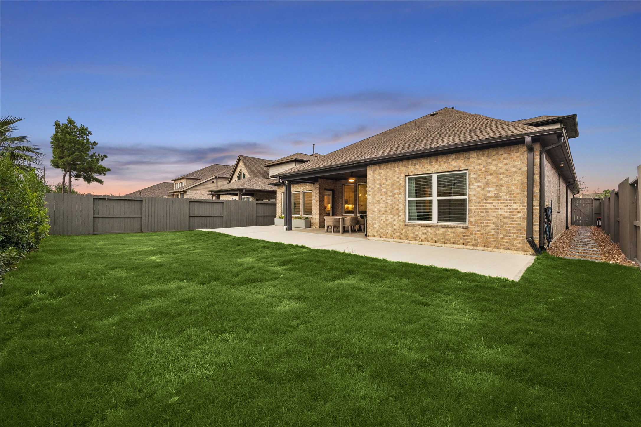 large 7,425sqft lot. back patio addition, side pavers and rock with lush low maintenance landscaping.
